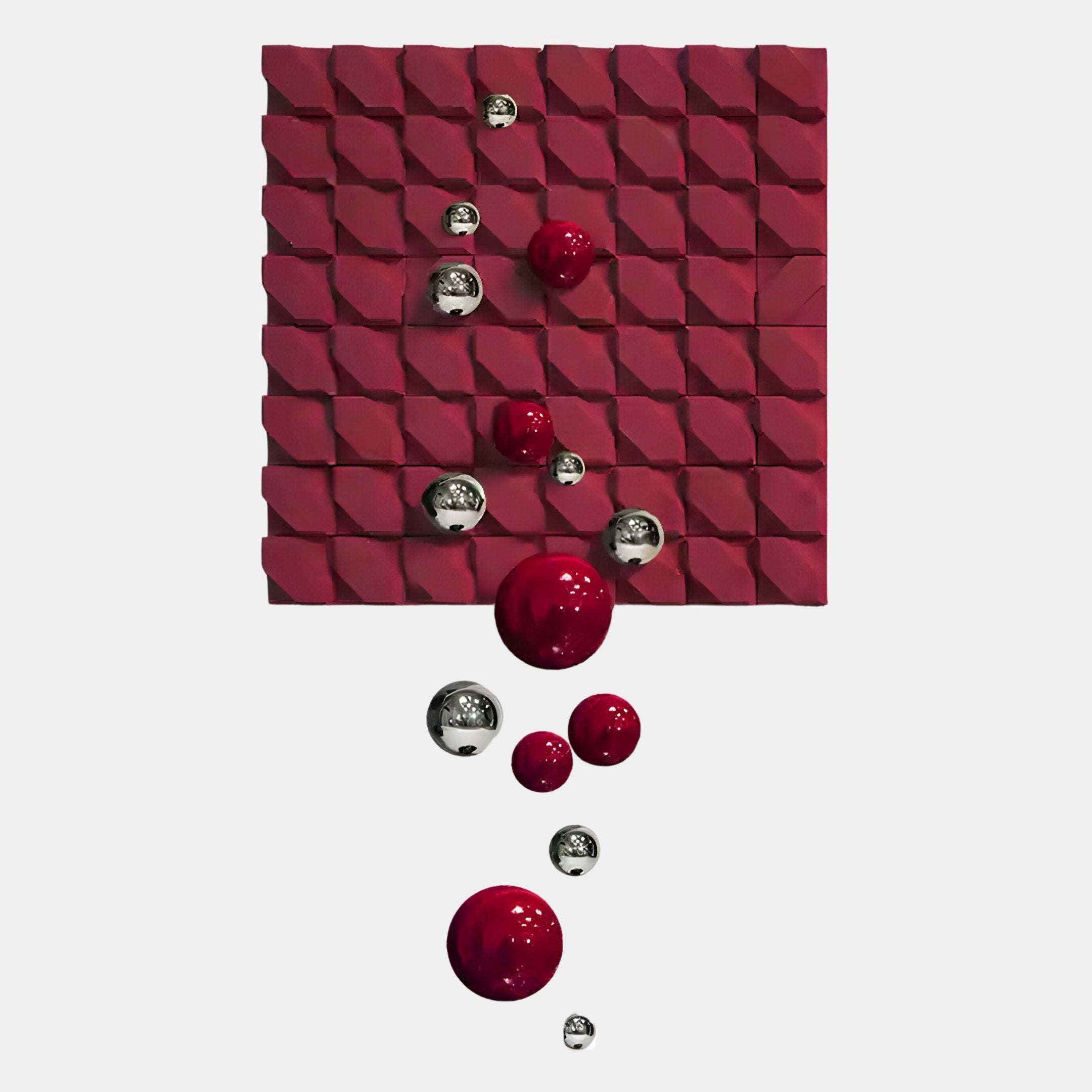The Orbina Crimson Red 3D Wood Relief Wall Art With Metal Ball by Giant Sculptures features a square grid with a vivid crimson red 3D wood relief, accented by shiny red and silver spheres of varying sizes across and below the grid.