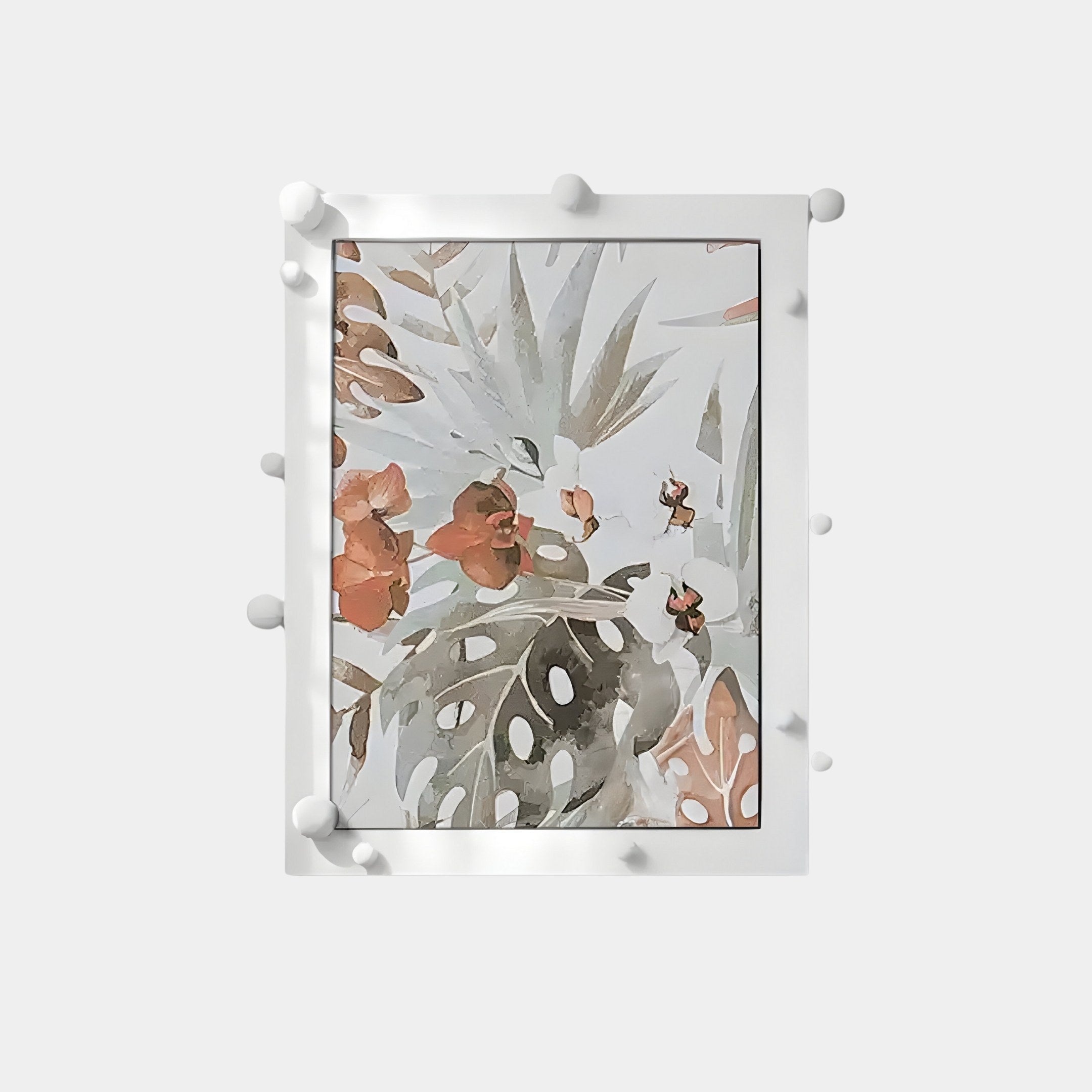 The Florere Botanical Harmony Hand-Painted Sandstone 3D Wall Art by Giant Sculptures features an abstract floral design with orange and green leaves, surrounded by a white frame with spherical accents. Its light gray backdrop adds elegance to any room.