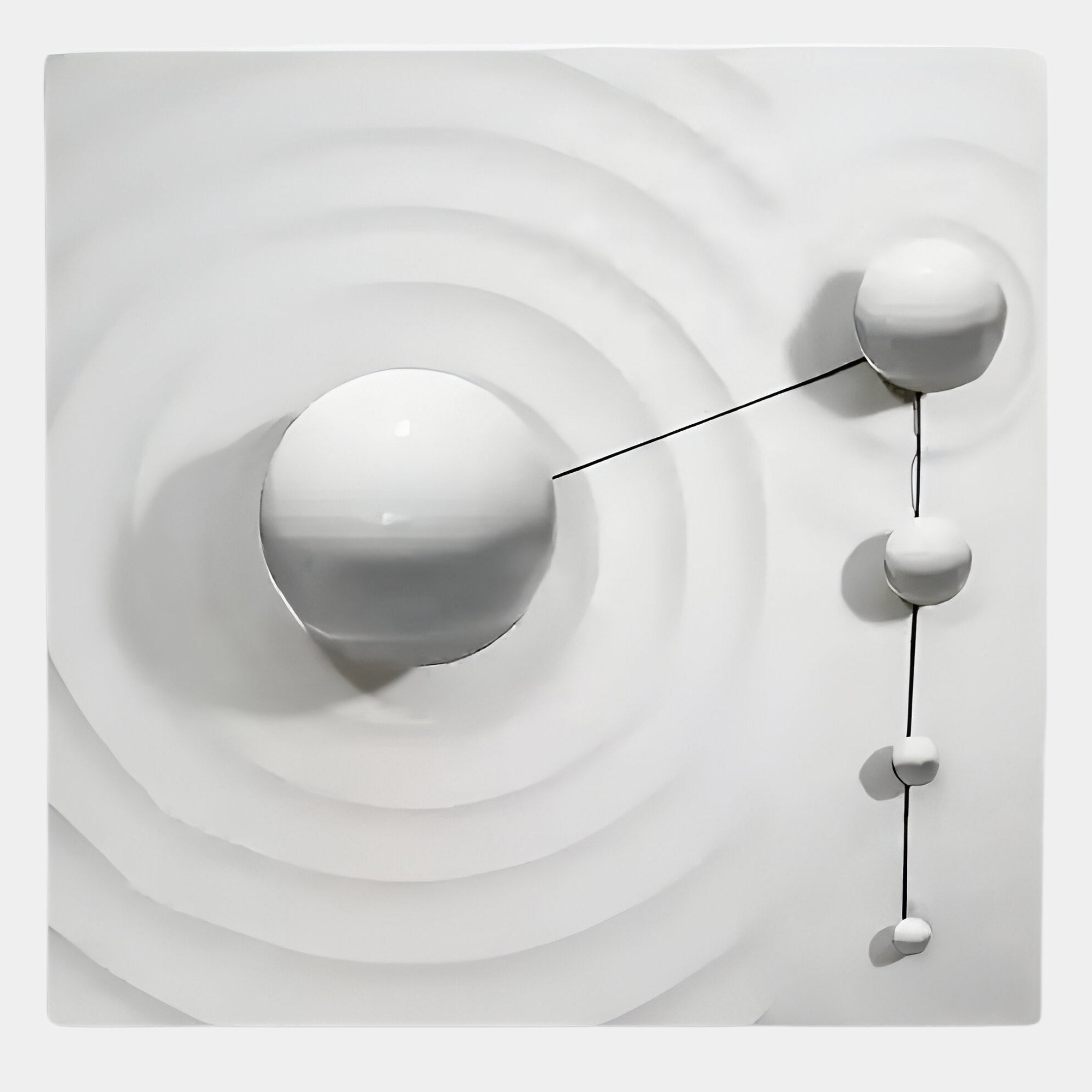 The Galactica White Wood Relief 3D Wall Art With White Metal Ball by Giant Sculptures features five glossy spheres of different sizes linked by thin lines on a textured white background with concentric grooves.