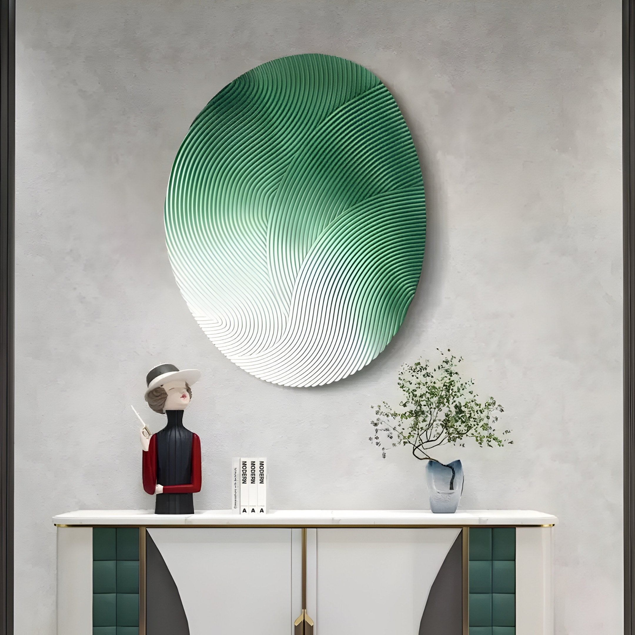 A modern interior features the Fluctus Green Textured Sandstone Wood Relief 3D Wall Art by Giant Sculptures above a console table adorned with a potted plant, a hat-wearing figure sculpture, and a small book.