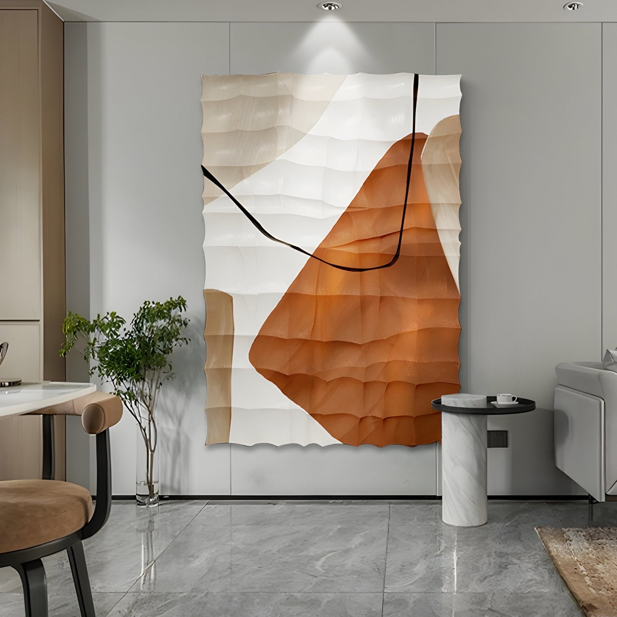 The Terracurve III 3D wall art, a hand-painted sandstone wood relief by Giant Sculptures, in beige, brown, and black tones enhances a modern space on a light grey wall. Nearby are a marble-topped table and potted plant, with part of a grey sofa visible.