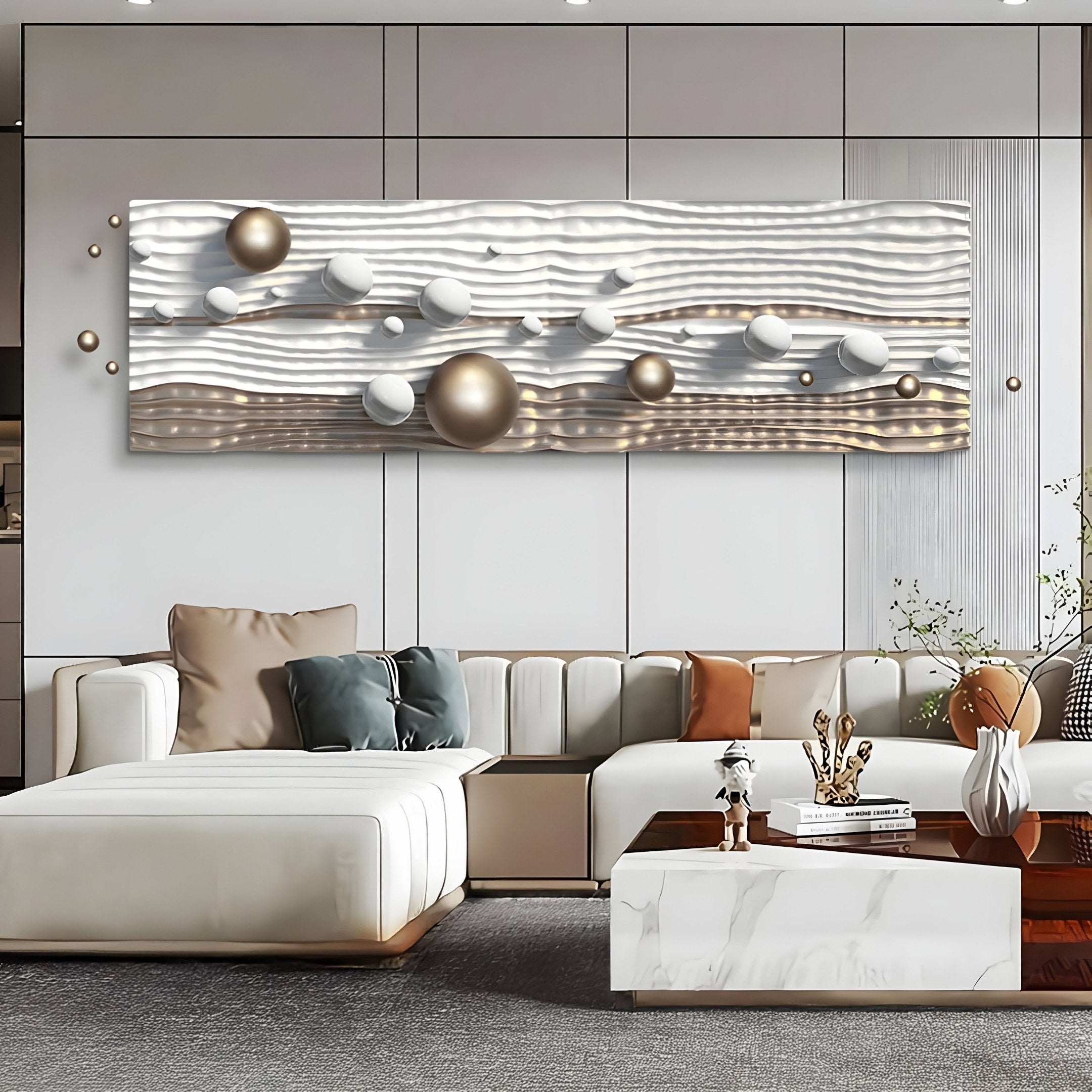 A modern living room featuring a white sectional sofa, a marble coffee table, and Giant Sculptures Lustra Gold & White 3D Wood Relief Wall Art With Metal Ball, showcasing metallic textures with silver and bronze elements. The neutral palette is enhanced by plush cushions and decorative accents.