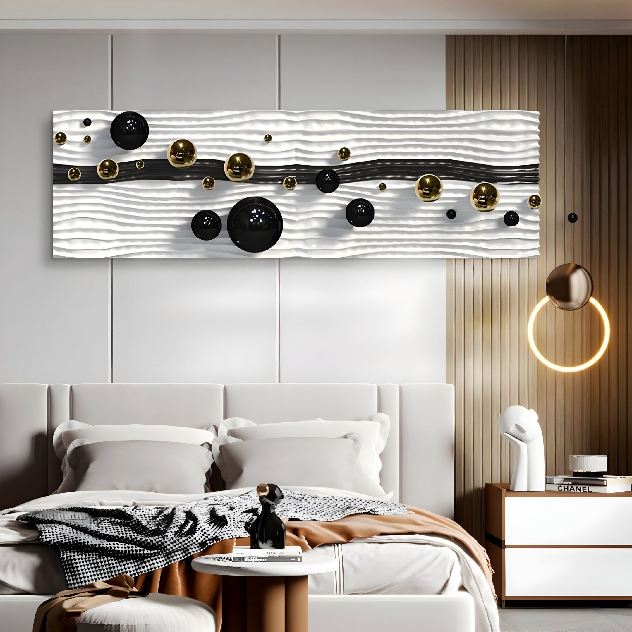 A modern bedroom features the Lustra Black & White 3D Wood Relief Wall Art With Metal Ball from Giant Sculptures above the bed, showcasing metallic spheres on a textured background. The room also includes a neatly made bed, a bedside table, and a uniquely designed circular light fixture.