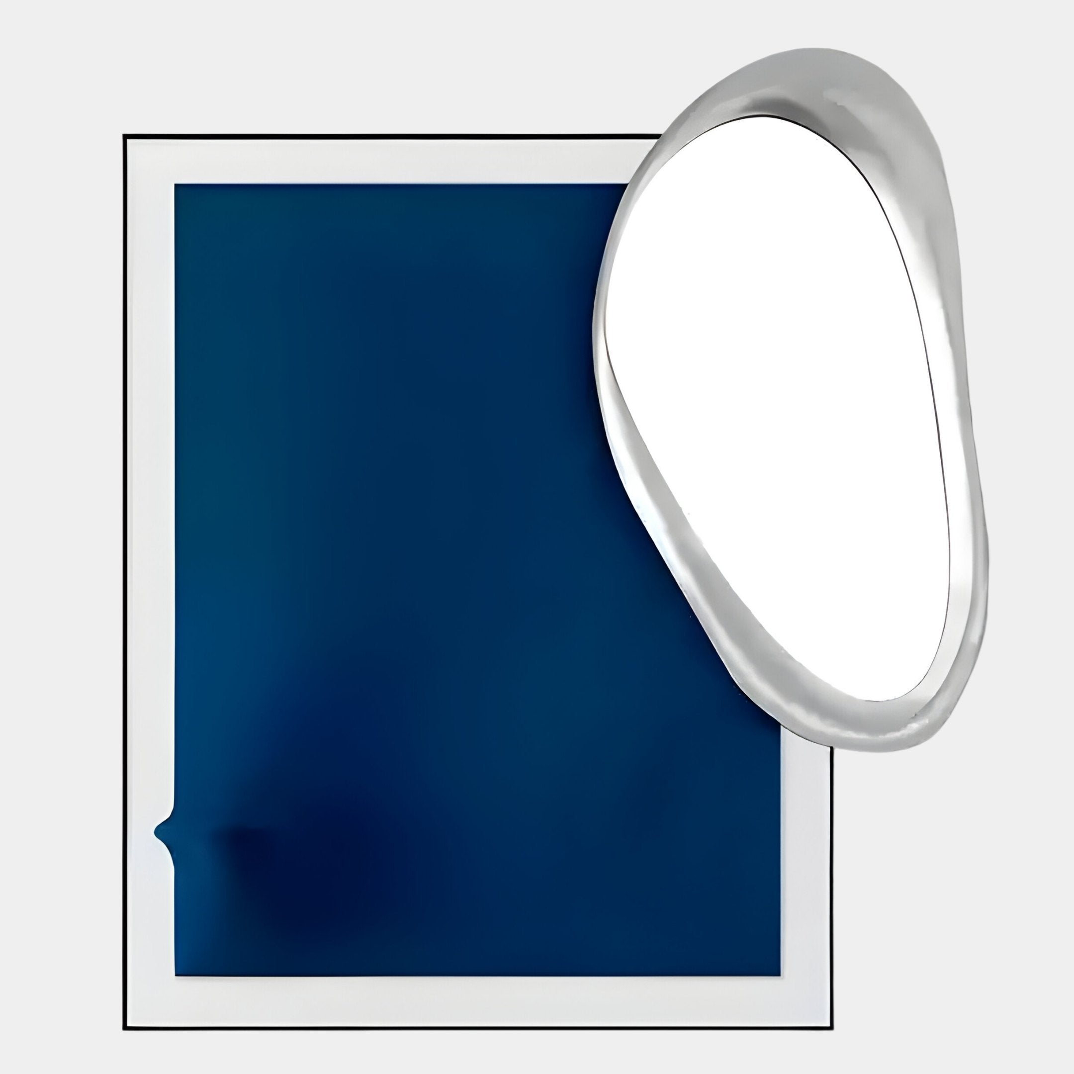 The Reflectra Deep Blue Wood Relief 3D Wall Art With Silver Mirror by Giant Sculptures features a rectangular deep blue piece with a white border beside a shiny silver mirror, overlapped at the top right, against a light gray background.