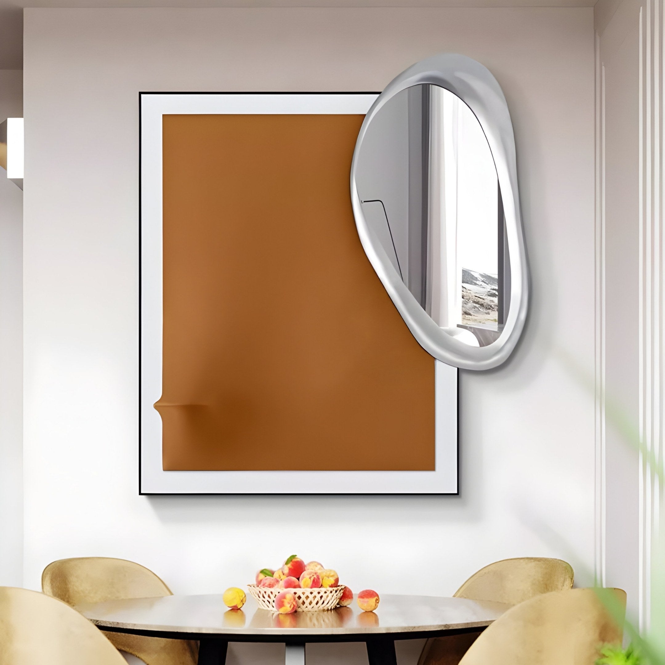 The modern dining area includes a round table with plush beige chairs and a fruit bowl, all beneath the impressive Reflectra Brown Wood Relief 3D Wall Art With Silver Mirror by Giant Sculptures. An irregularly shaped oval mirror complements the large abstract artwork on the wall.