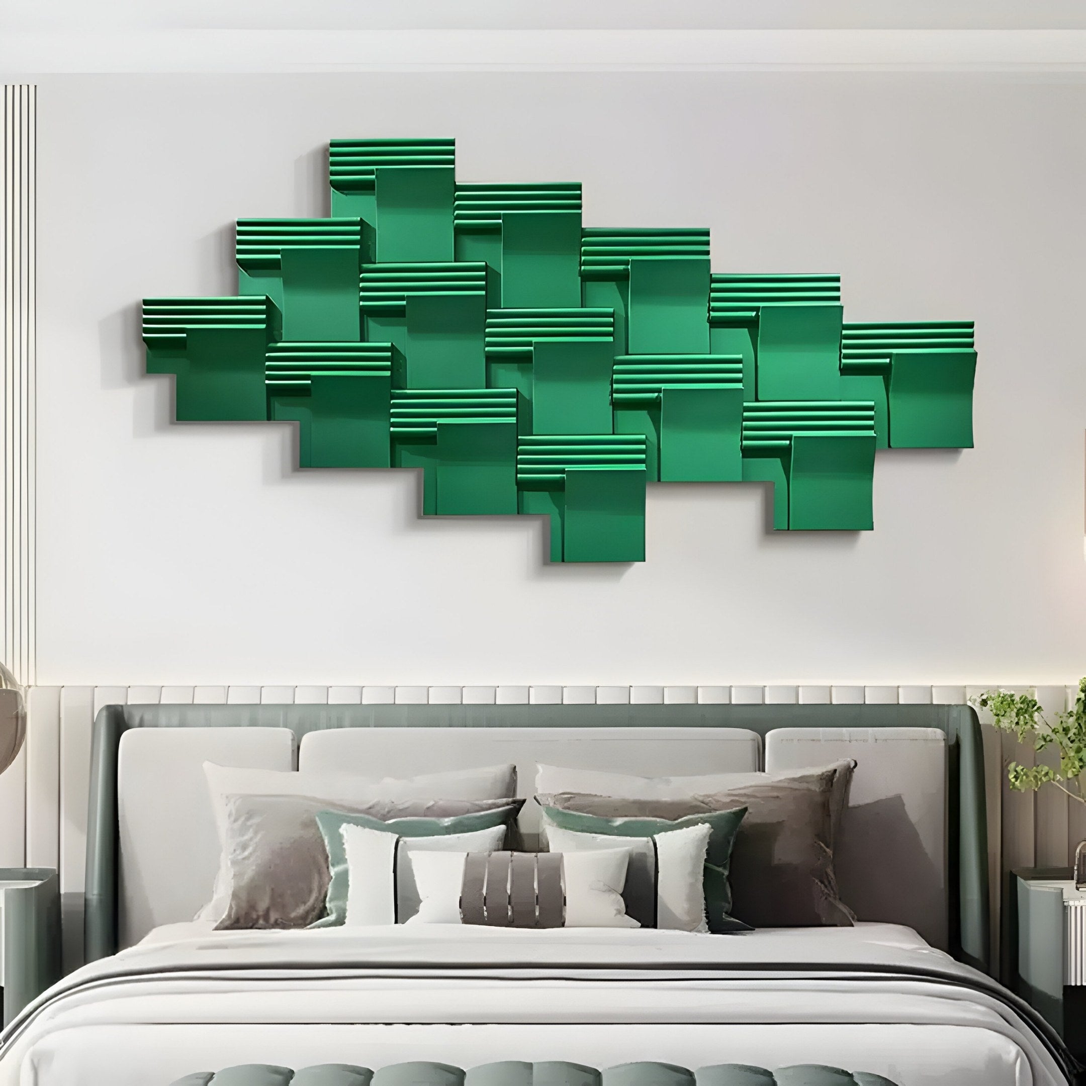 A modern bedroom features a neutral-toned bed with decorative pillows. Above it, the Axura Green Geometric Wood Relief Hand-Painted 3D Wall Art from Giant Sculptures adds color and depth. Its intricate intersecting rectangles enhance the rooms minimalist and stylish design.