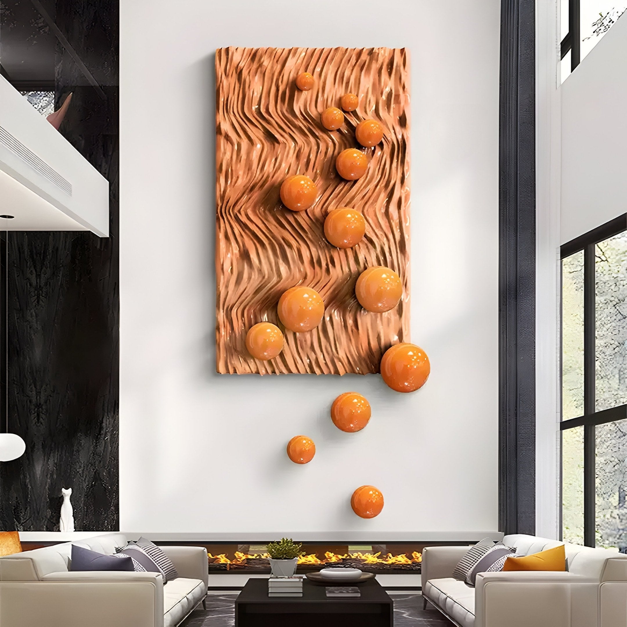 A modern living room with a high ceiling features contemporary decor, including the Fluxion Orange 3D Wood Relief Wall Art With Metal Ball by Giant Sculptures, displaying a striking design. Two white sofas and a sleek fireplace sit below it, while tall windows illuminate the space naturally.