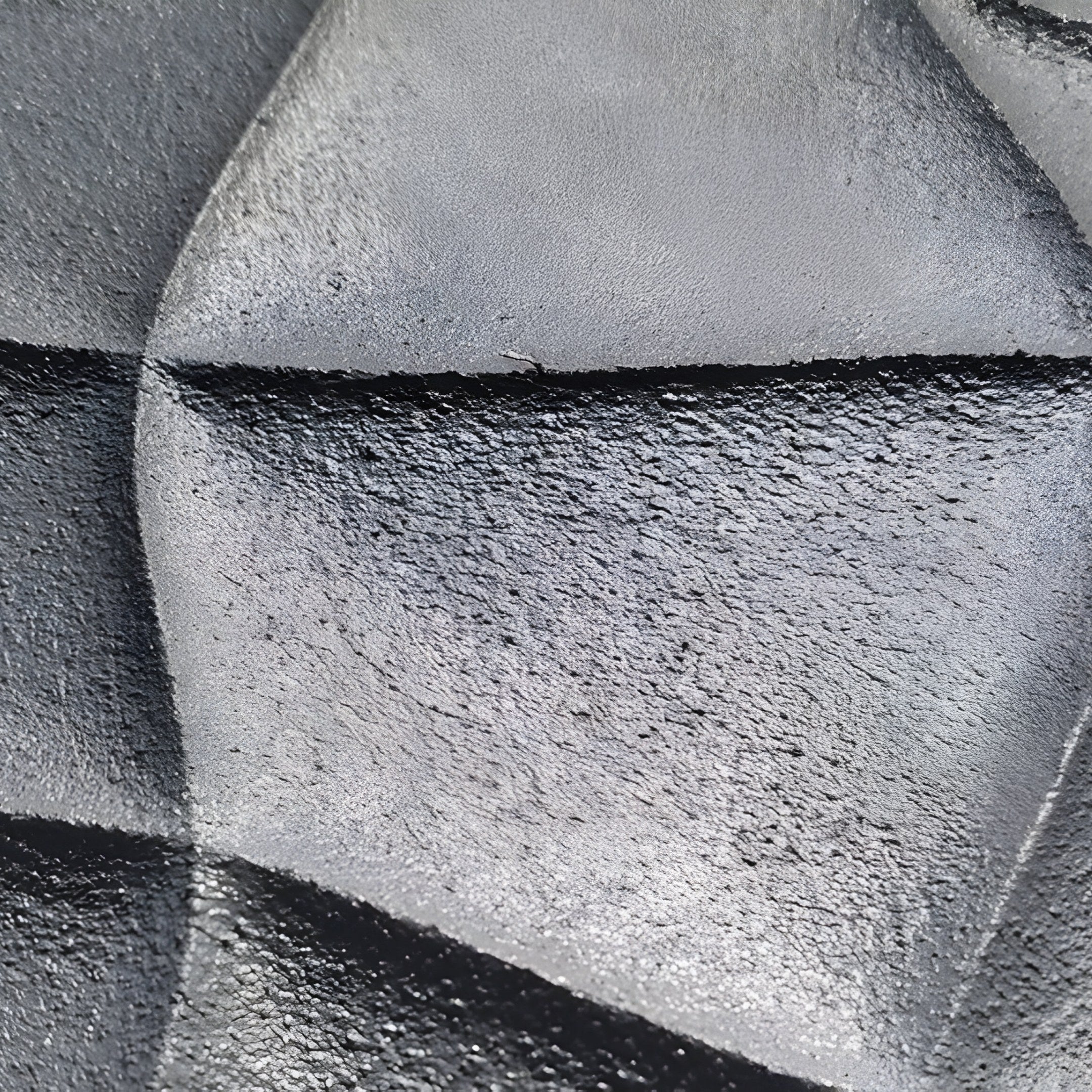 The Orbita 6-Set Circular Neutral Grey 3D Wood Relief Wall Art by Giant Sculptures features a textured metallic look with geometric folds, where angular ridges shift from dark to light gray, offering a solid and reflective pattern perfect for interior decoration.