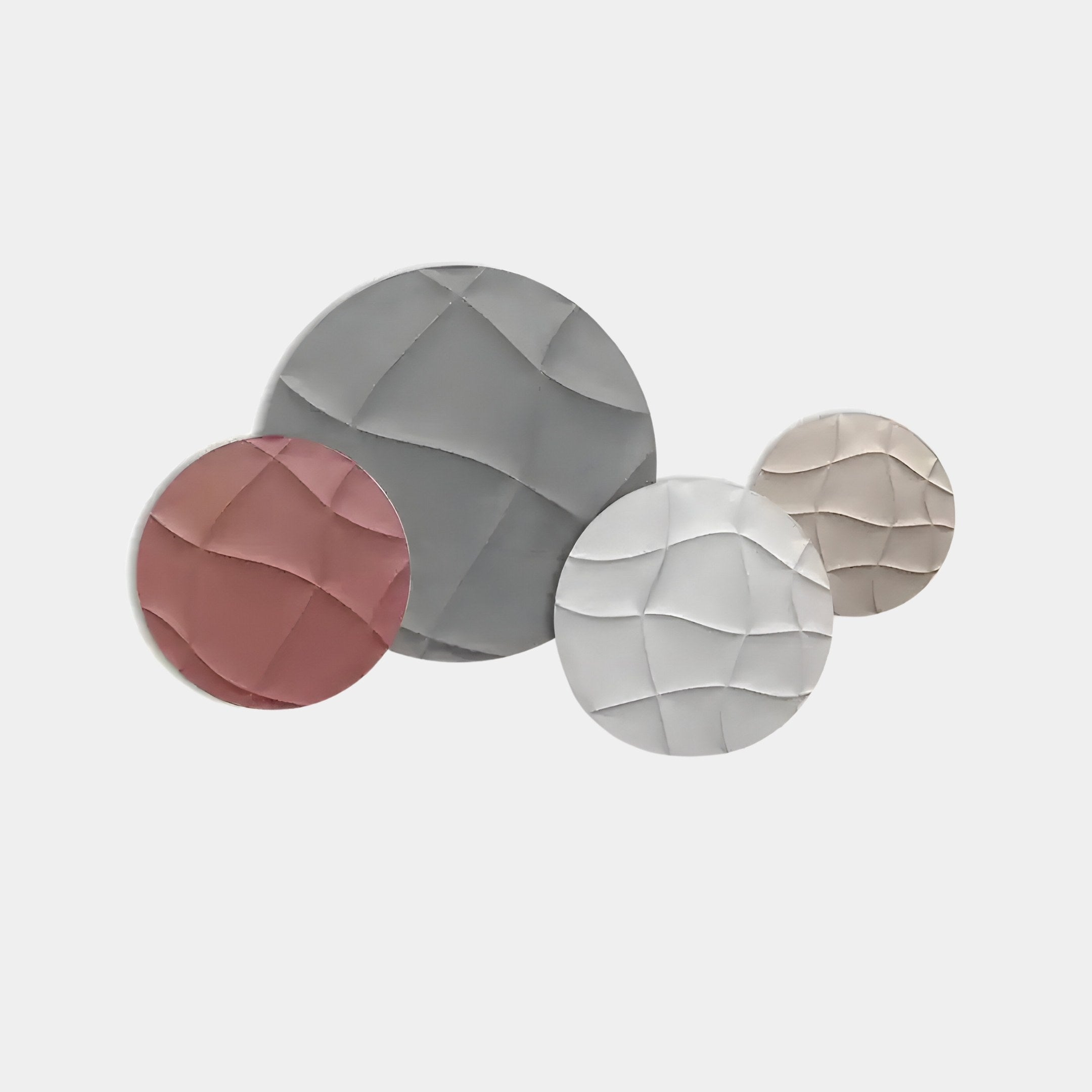 The Orbita 4-Set Circular Blush & Ivory 3D Wood Relief Wall Art from Giant Sculptures showcases four panels in gray, blush, white, and beige with textured wave patterns. Like refined wall art, the ceramic tiles cluster beautifully on a plain white surface.