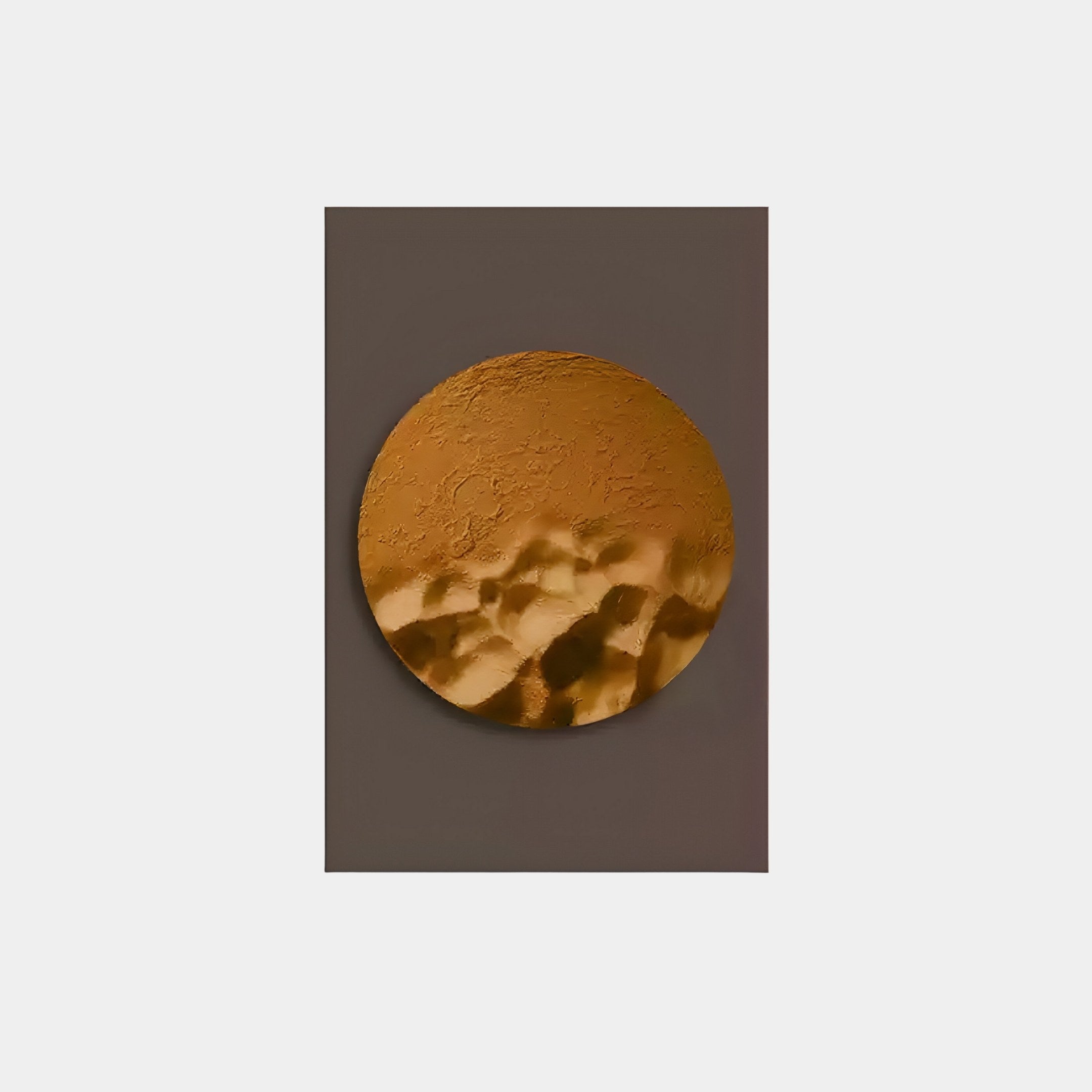 Solivis Amber 3D Wood Relief by Giant Sculptures: A large hand-painted circular abstract art piece with textured gold and bronze shades on dark gray. Its reflective surface features patterns reminiscent of an amber wood relief or planetary landscape.