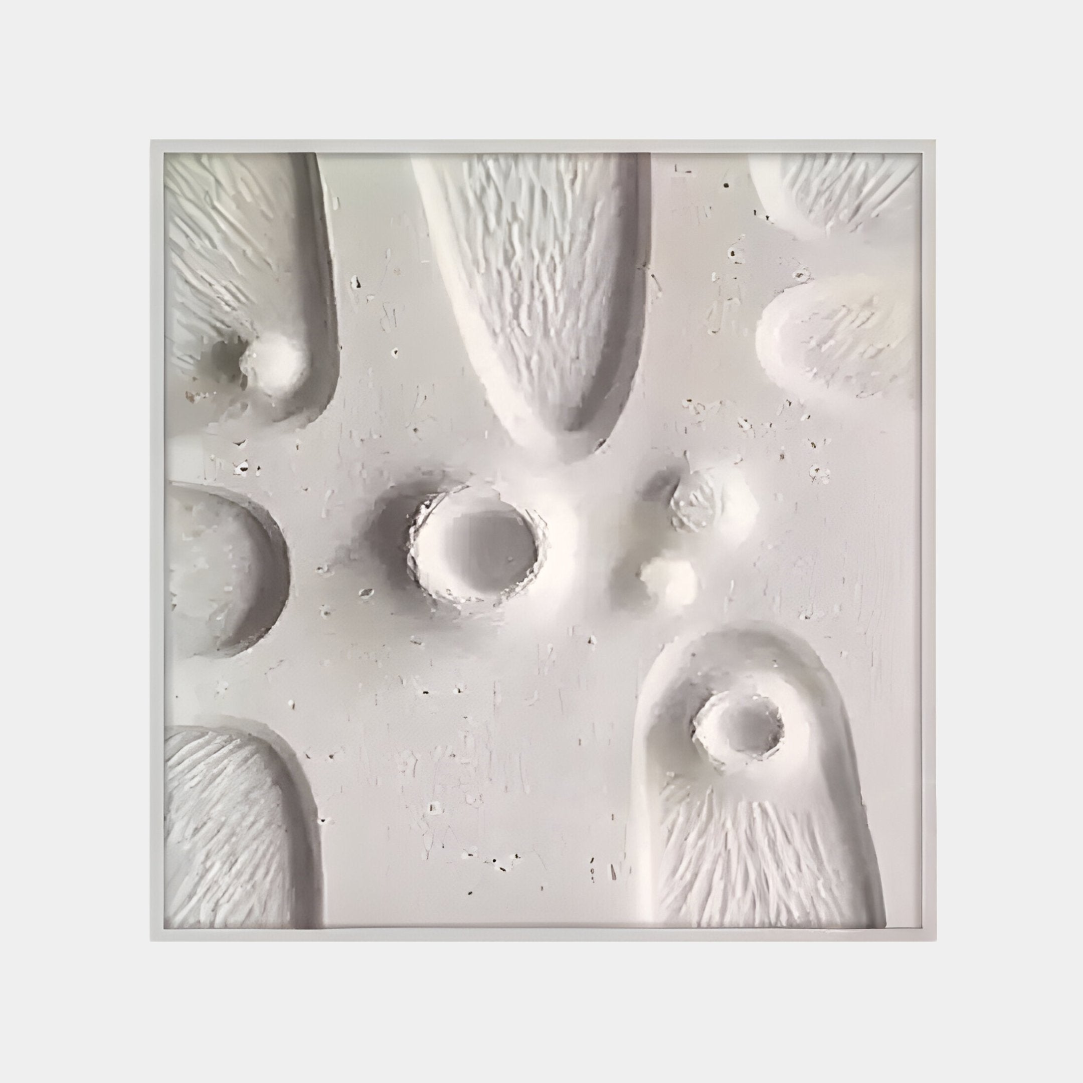 The Terravura Square Soft White II 3D Wood Relief Wall Art by Giant Sculptures features abstract textures with rounded and elongated indentations, creating a three-dimensional effect. Shadows enhance the depth of this minimalist décor piece.