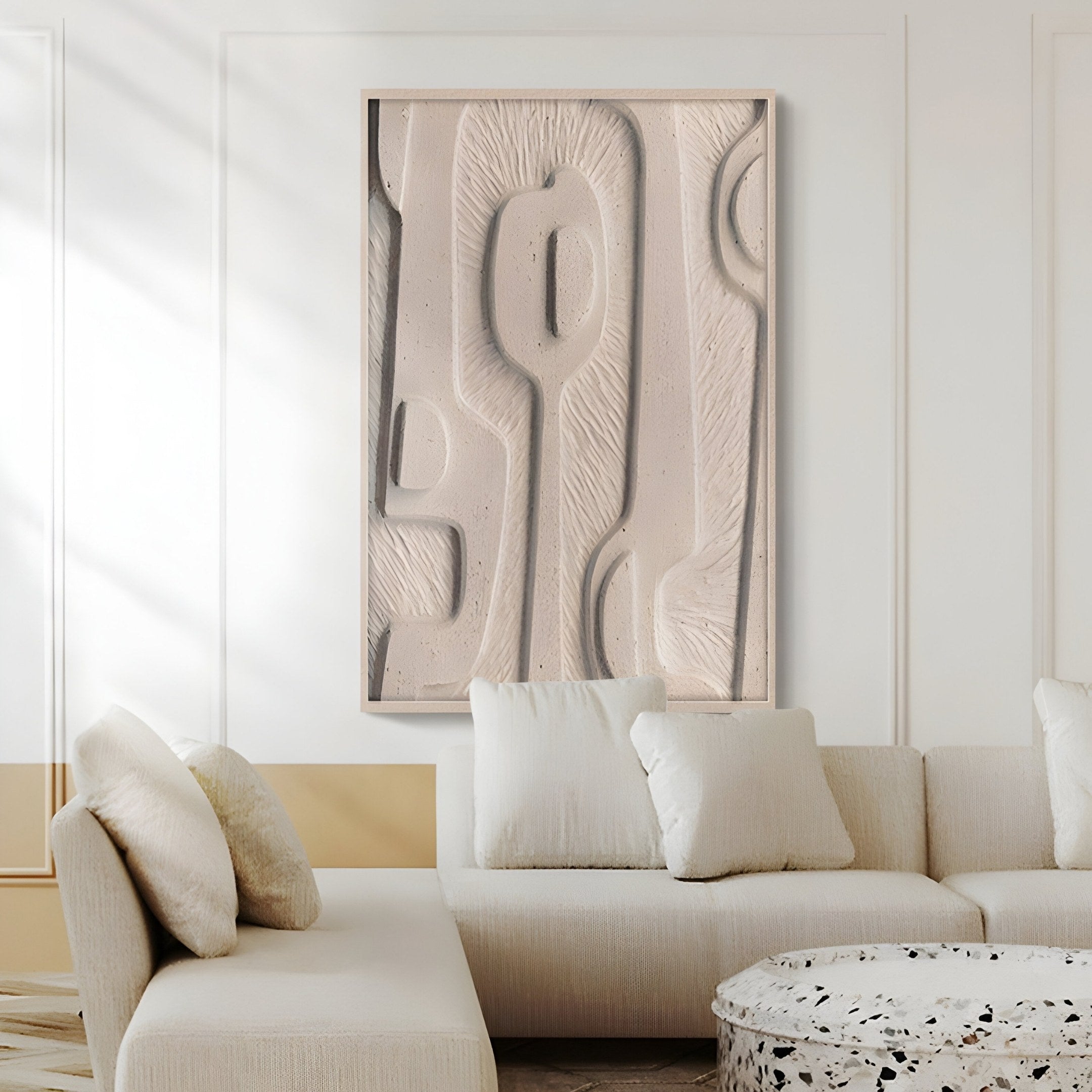 A modern living room exudes a natural feel, featuring the Giant Sculptures Terravura Rectangular Warm Beige I 3D Wood Relief Wall Art. A light-colored sofa with plush cushions complements a subtly patterned round coffee table, creating minimalist and elegant decor.