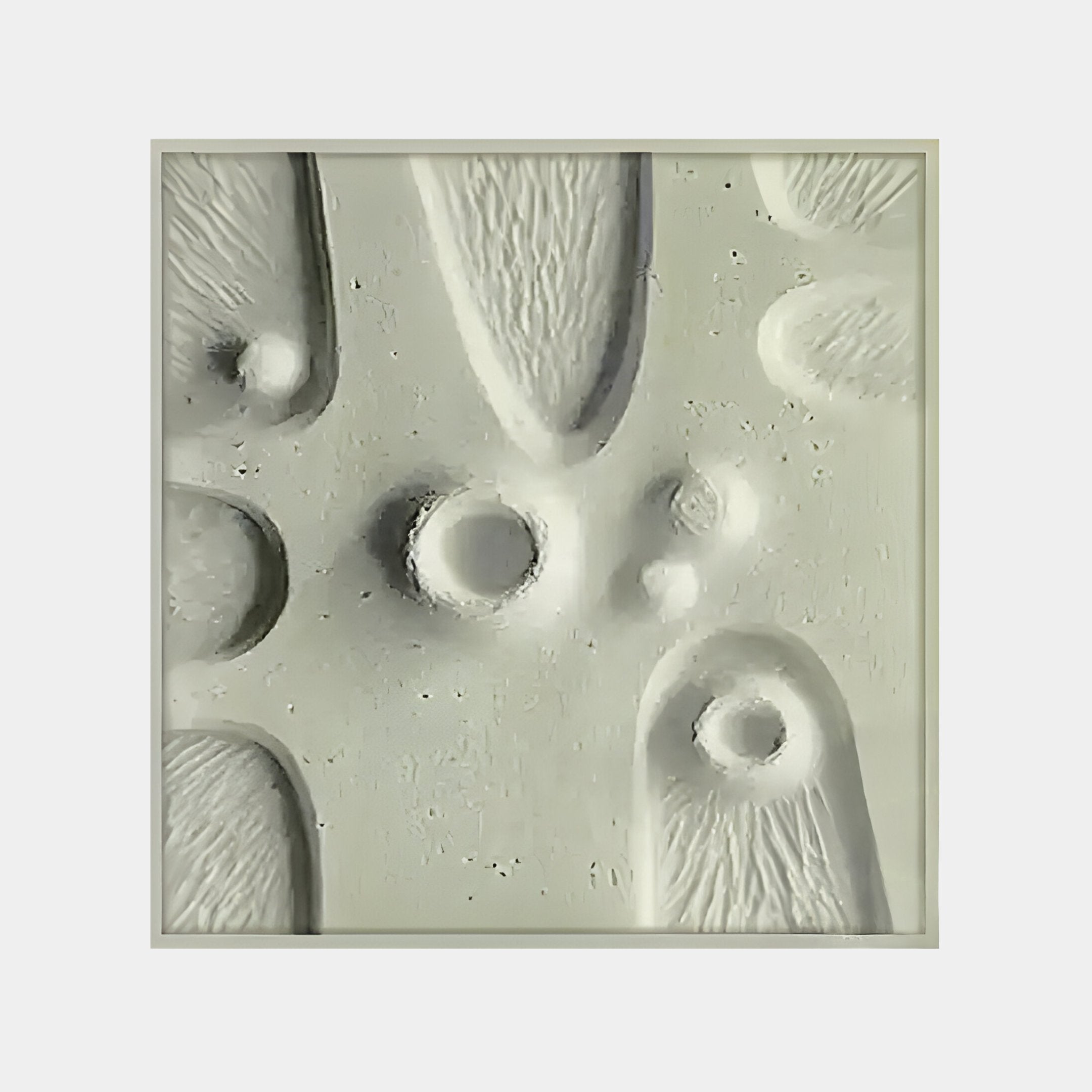 The Terravura Square Sage Green II 3D Wood Relief Wall Art by Giant Sculptures features textured, raised circles and elongated forms in a monochrome palette. Its embossed surface mixes smooth and rough patterns, making it perfect for minimalist interiors seeking an intriguing visual effect.