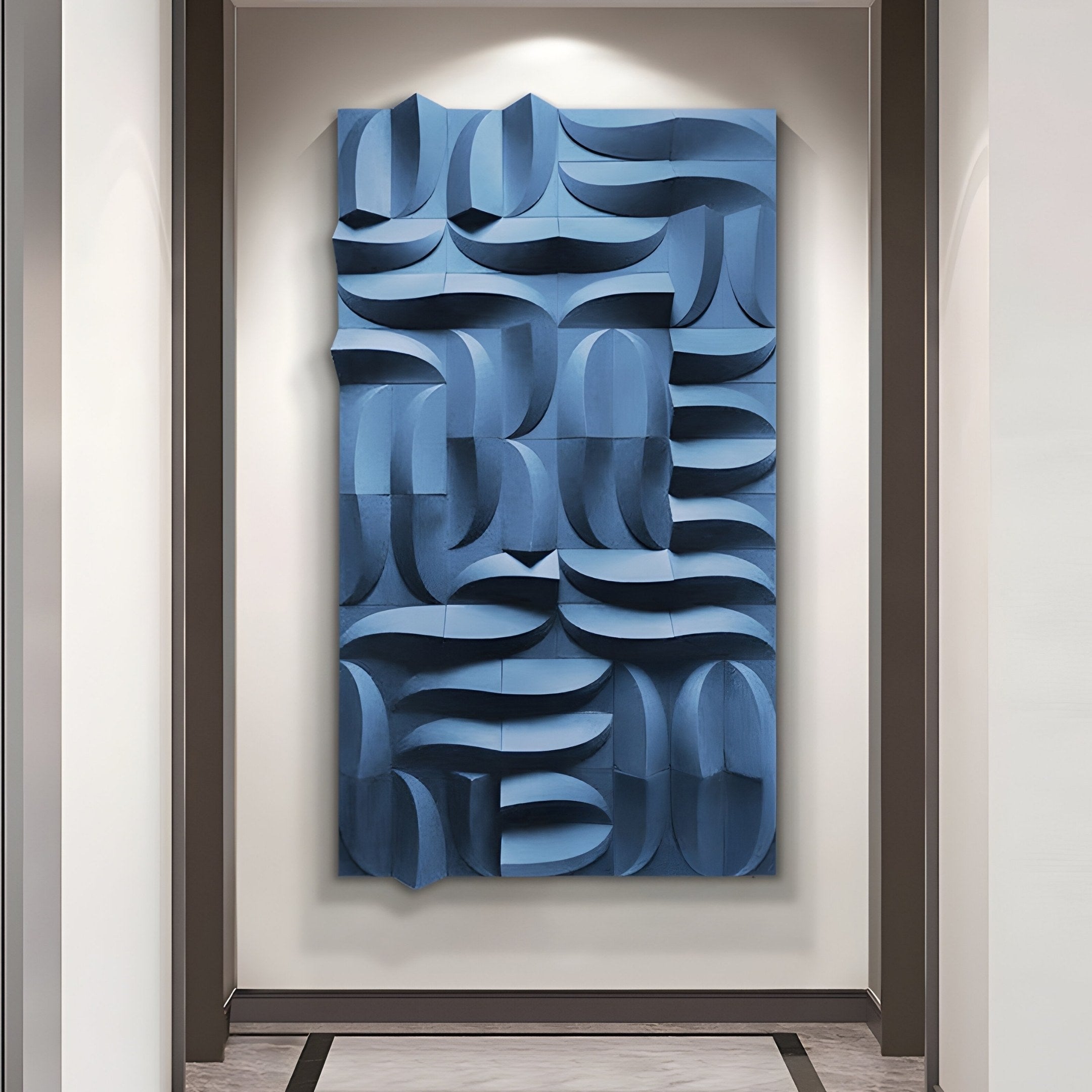 A modern art installation with a geometric design showcases Giant Sculptures Ombra Blue Hand-Painted Sandstone 3D Wood Relief Wall Art. Curved, overlapping panels create a dynamic effect against minimalist light-colored walls and floor.