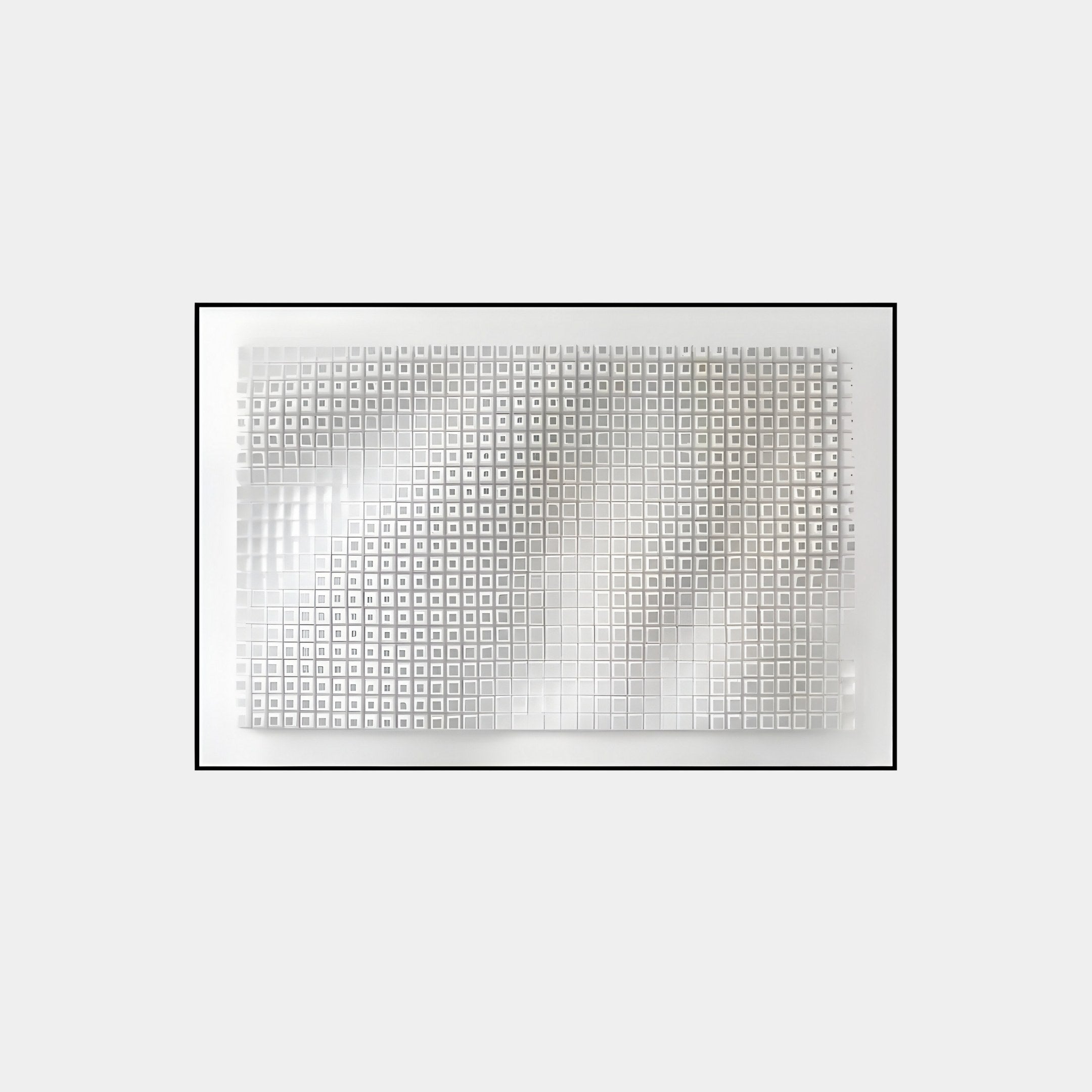 The Elytrum White Grid Hand-Painted Wood Relief 3D Wall Art by Giant Sculptures features a textured, abstract array of raised white squares on a rectangular panel. The varying heights of the shapes cast subtle shadows, and its framed with a thin black line on a light gray background.