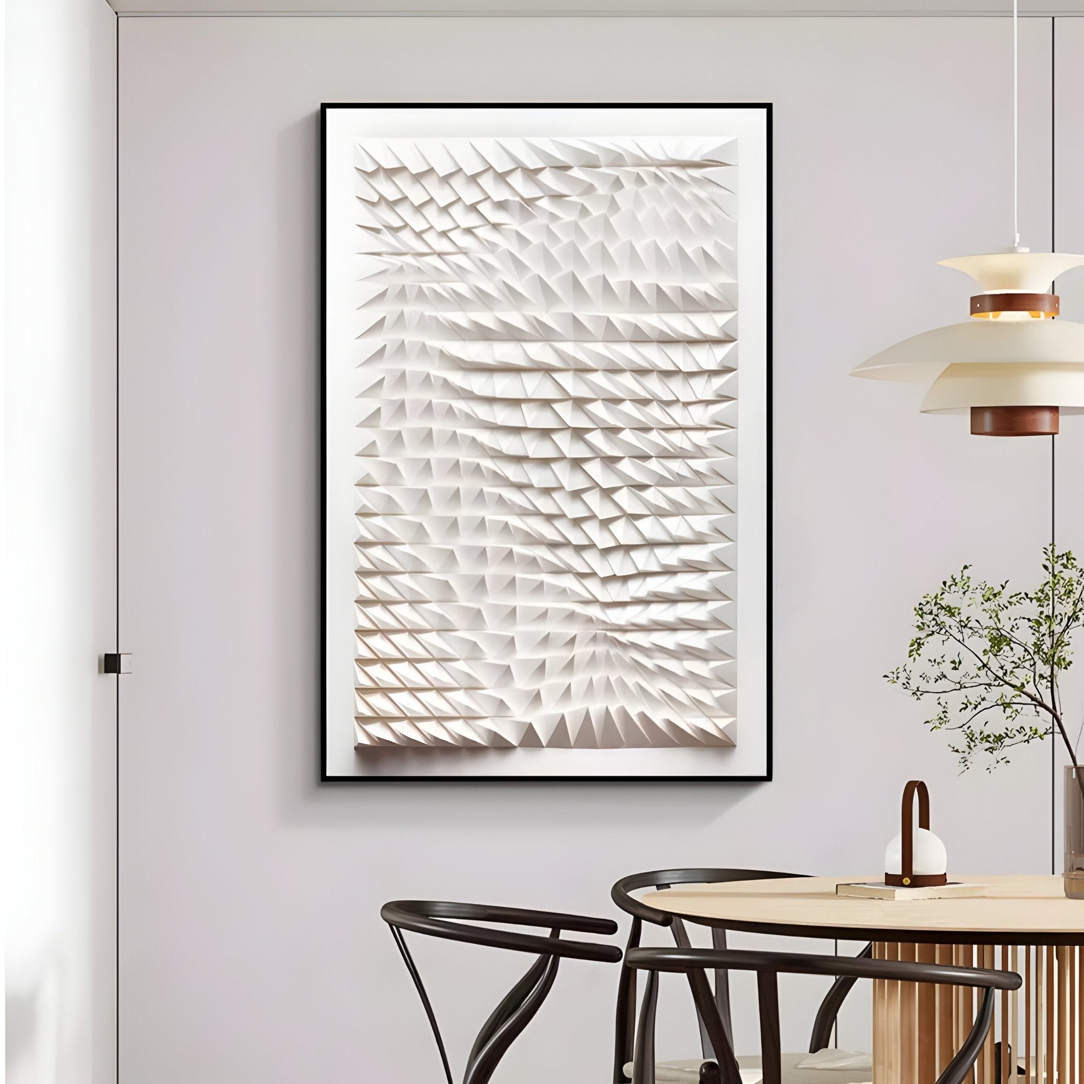 The modern dining room features the Elorium White Weave Hand-Painted Wood Relief 3D Wall Art by Giant Sculptures, showcasing a wavy texture with geometric triangular prisms. A minimalist table, chairs, and a small plant complement the textured relief art on the hand-painted wood surface.