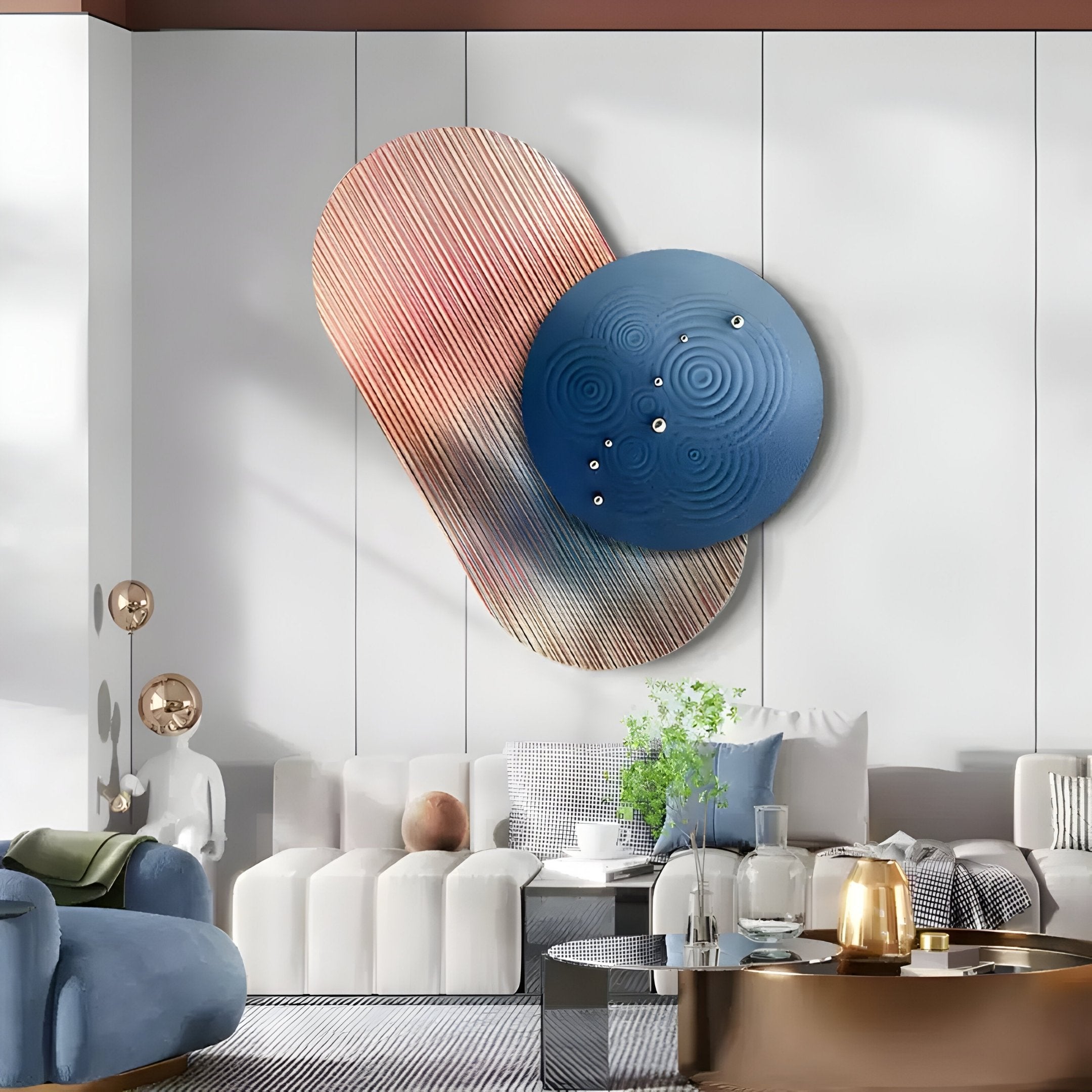 A modern living room features the Embera Abstract Circle Multicolour Gradient 3D Wall Art by Giant Sculptures with a red oval and blue circle. A white sectional sofa pairs with a glass coffee table, topped with a potted plant and decor items, while a spherical-light floor lamp adds sculptural detail.