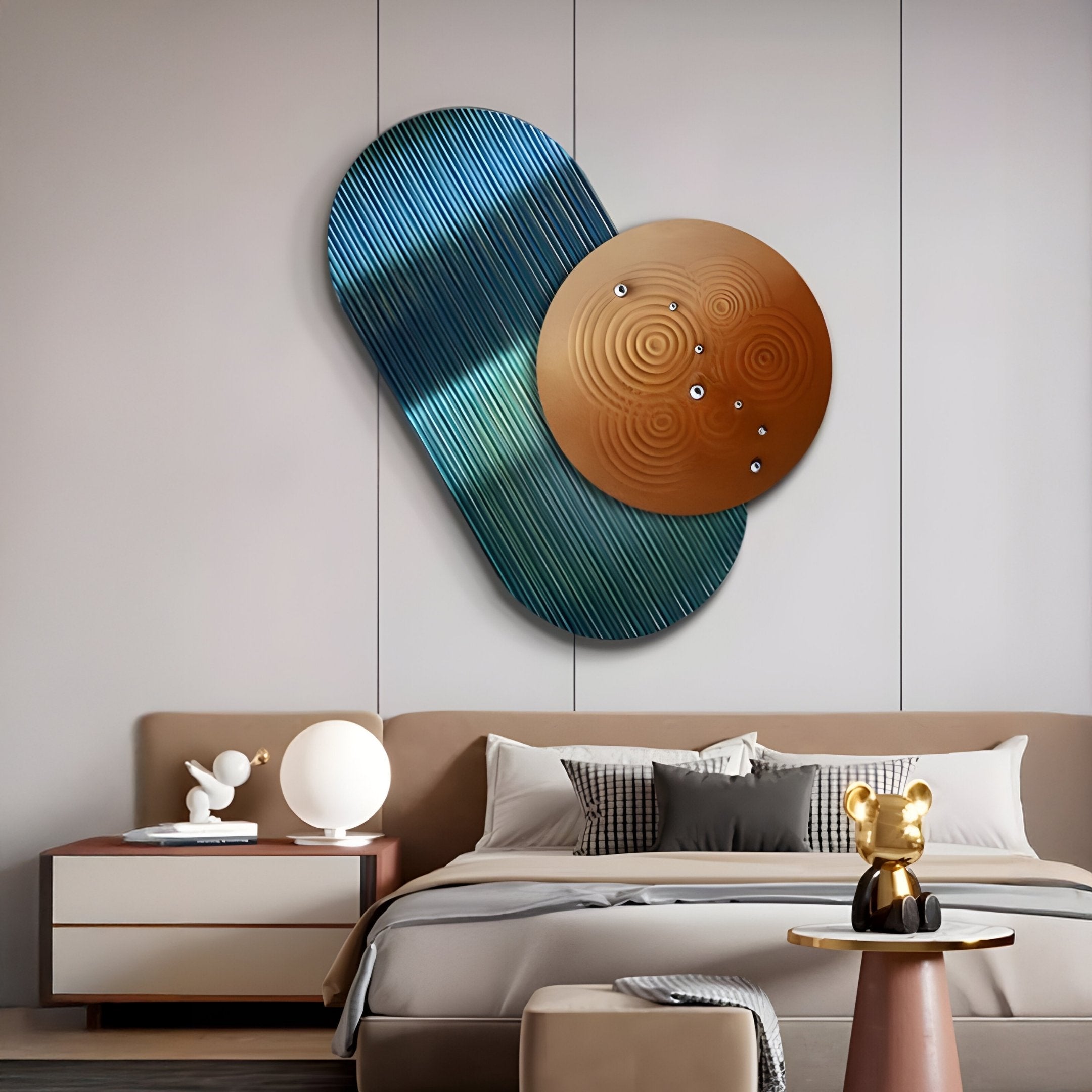 A modern bedroom with a minimalist style includes a beige bed and striped pillows. Nightstands display decorative objects, while a Giant Sculptures Embera Abstract Circle Teal Ombre 3D Wall Art with overlapping blue and bronze shapes enhances the space above the headboard.