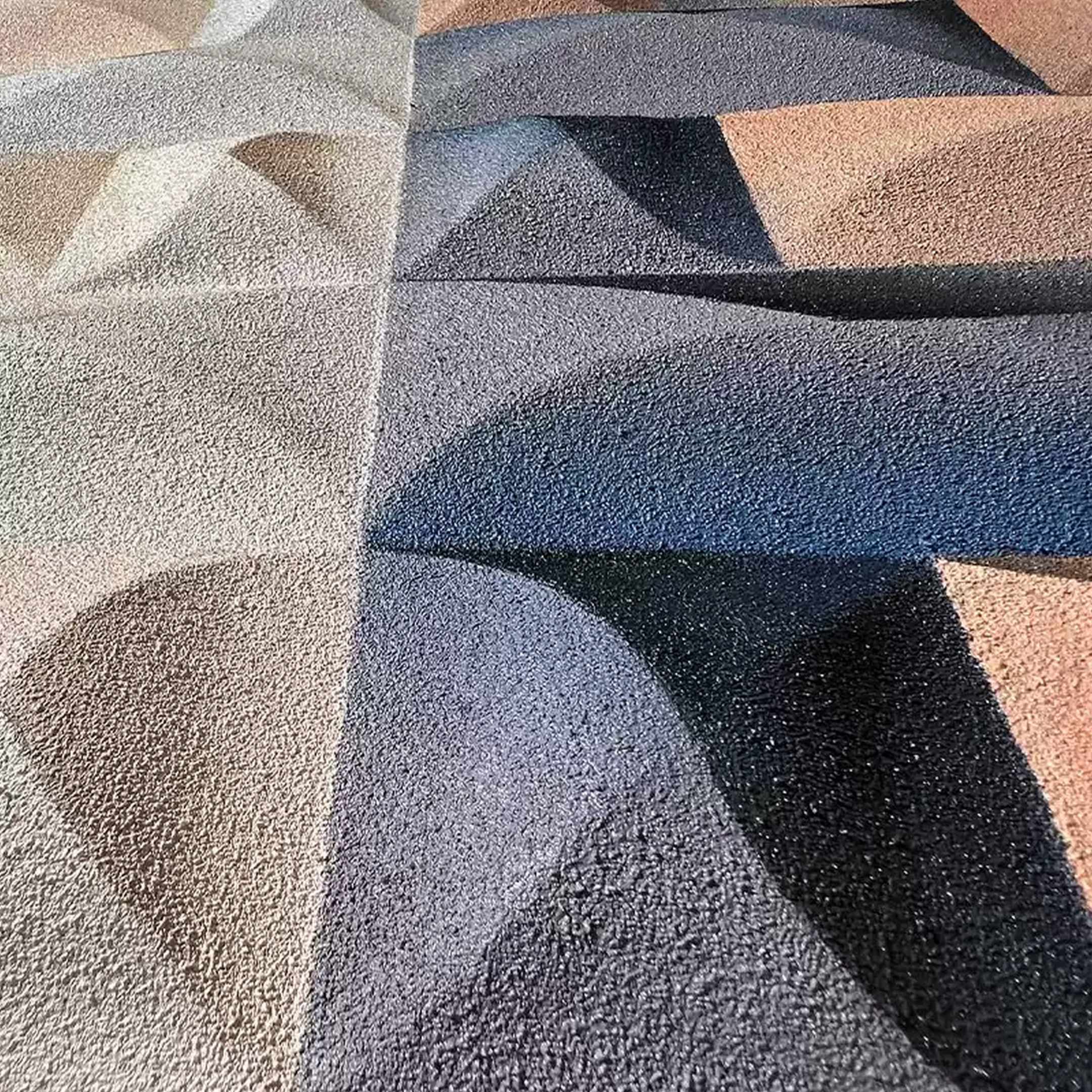 The Elysia Geometric Warm Gradient Wood Relief 3D Wall Art by Giant Sculptures showcases overlapping curves and shapes in gray, brown, and blue hues, with a textured surface that adds depth and a three-dimensional effect.