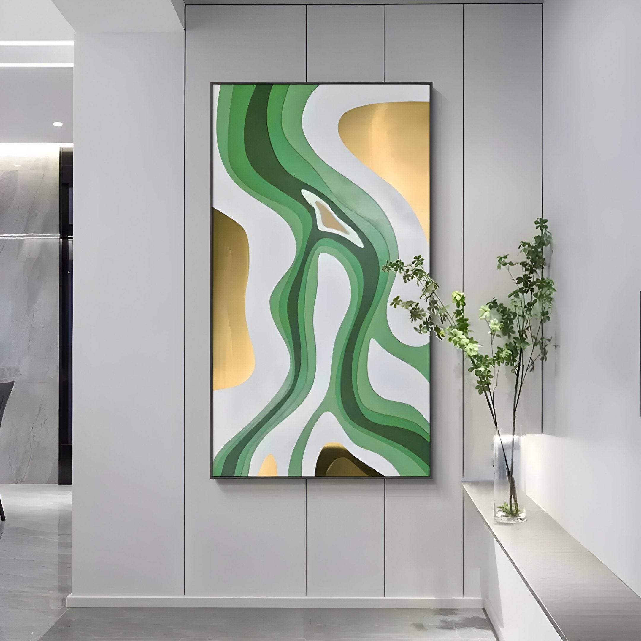The modern interior features the Marea Organic Flow Green & Gold Wood Relief 3D Wall Art by Giant Sculptures. Curved green, white, and gold shapes enhance the space above a bench with a slender-branched plant, infusing natural elegance into the sleek setting.