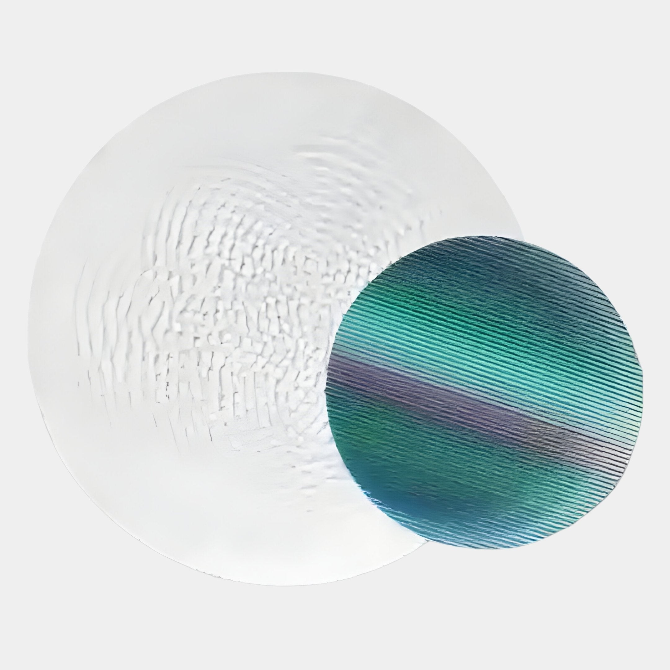 Two overlapping circles on a light background: the larger, white with subtle wavy textures, recalls the Lucentis White & Teal Gradient Wood Relief 3D Wall Art by Giant Sculptures; the smaller has blue, green, and purple striped patterns.