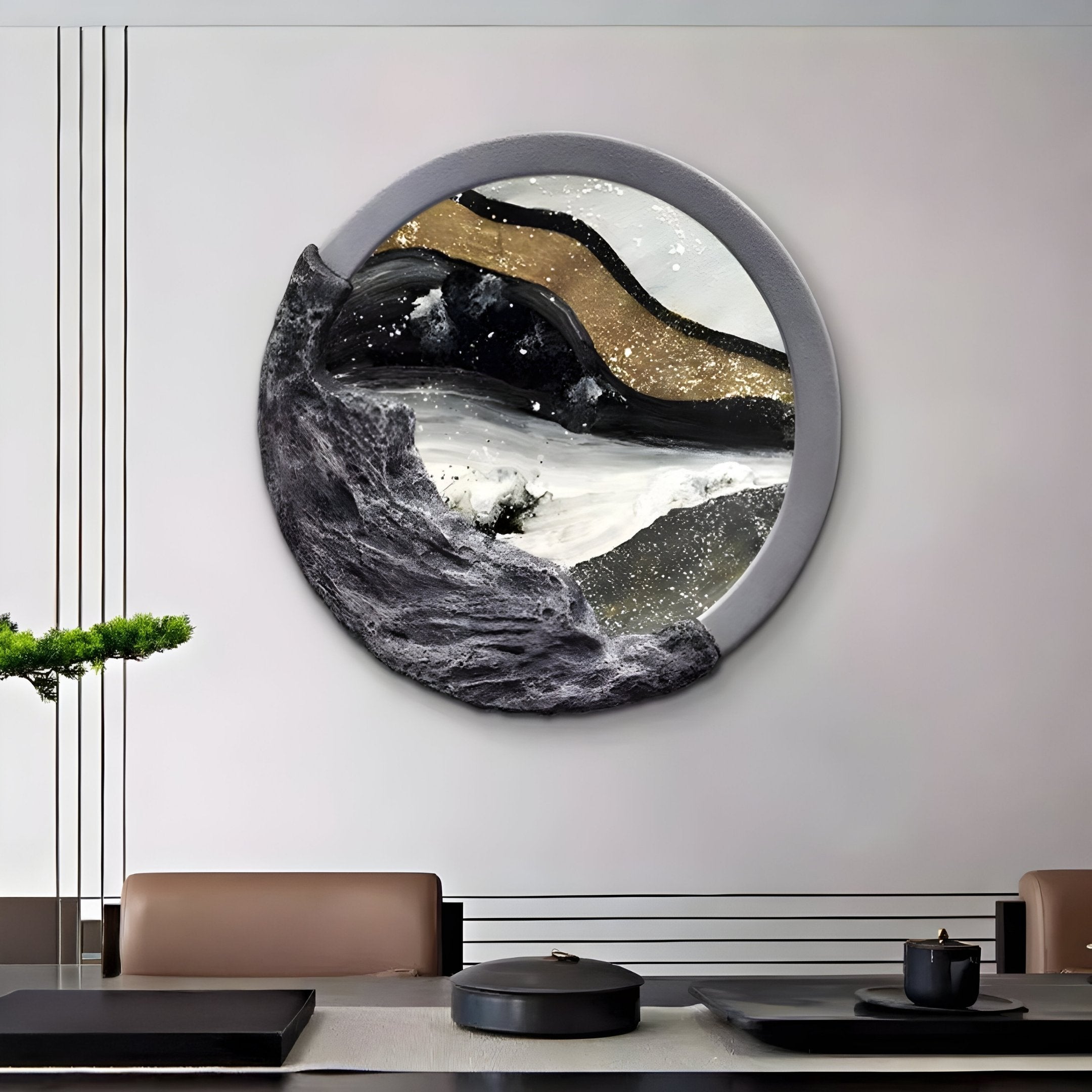 A modern dining room showcases the Auroria Rustic Horizon Hand-Painted Wood Relief 3D Wall Art by Giant Sculptures, featuring abstract black, gold, and white patterns. Below, a sleek table holds a teapot and cup alongside green foliage, maintaining the minimalist decor.