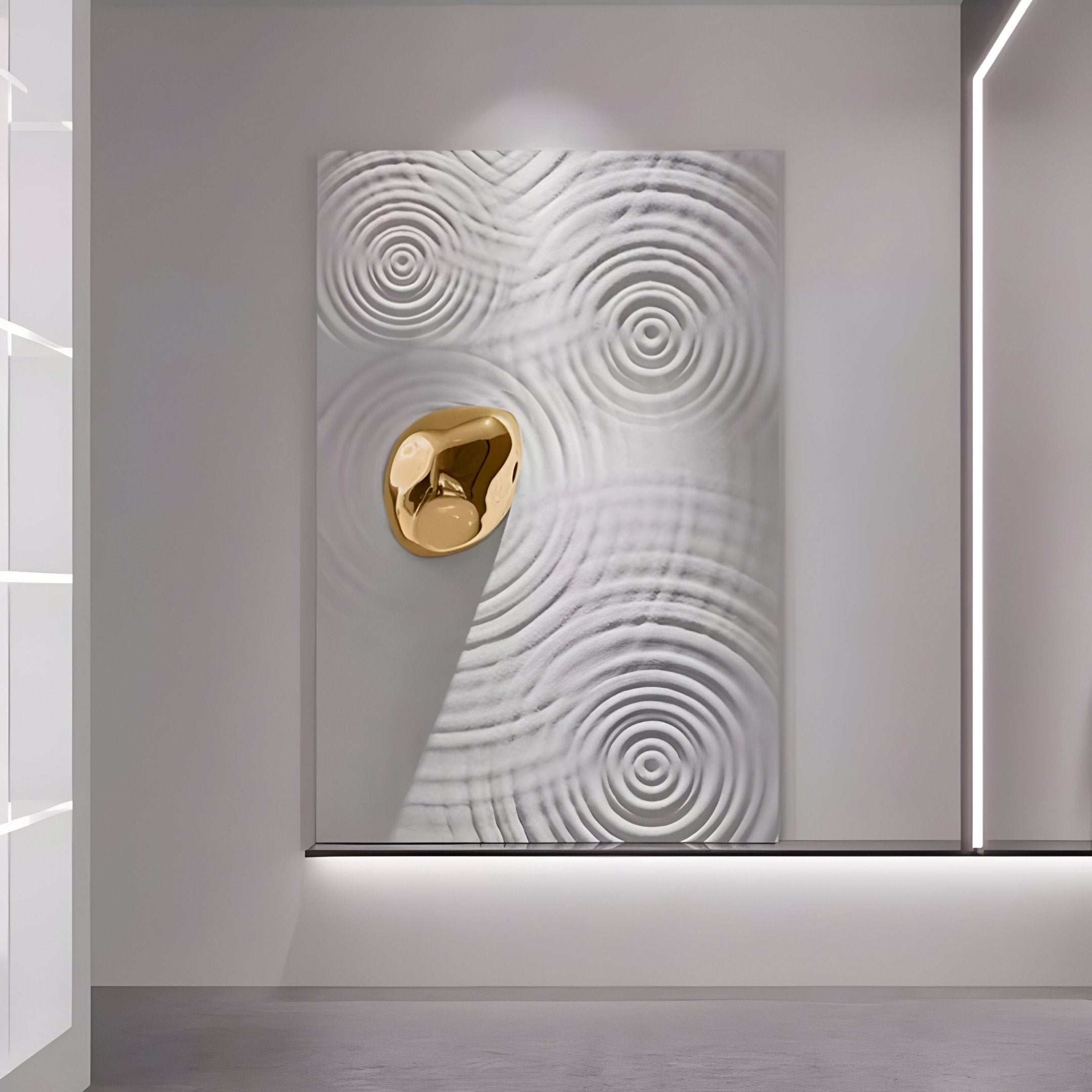 The Ondella Gold Ripple III Sandstone Wood Relief 3D Wall Art by Giant Sculptures showcases a textured white panel with concentric circles, akin to water ripples, highlighted by a reflective golden accent in the upper left, perfect for adding a contemporary touch to any minimalist wall.