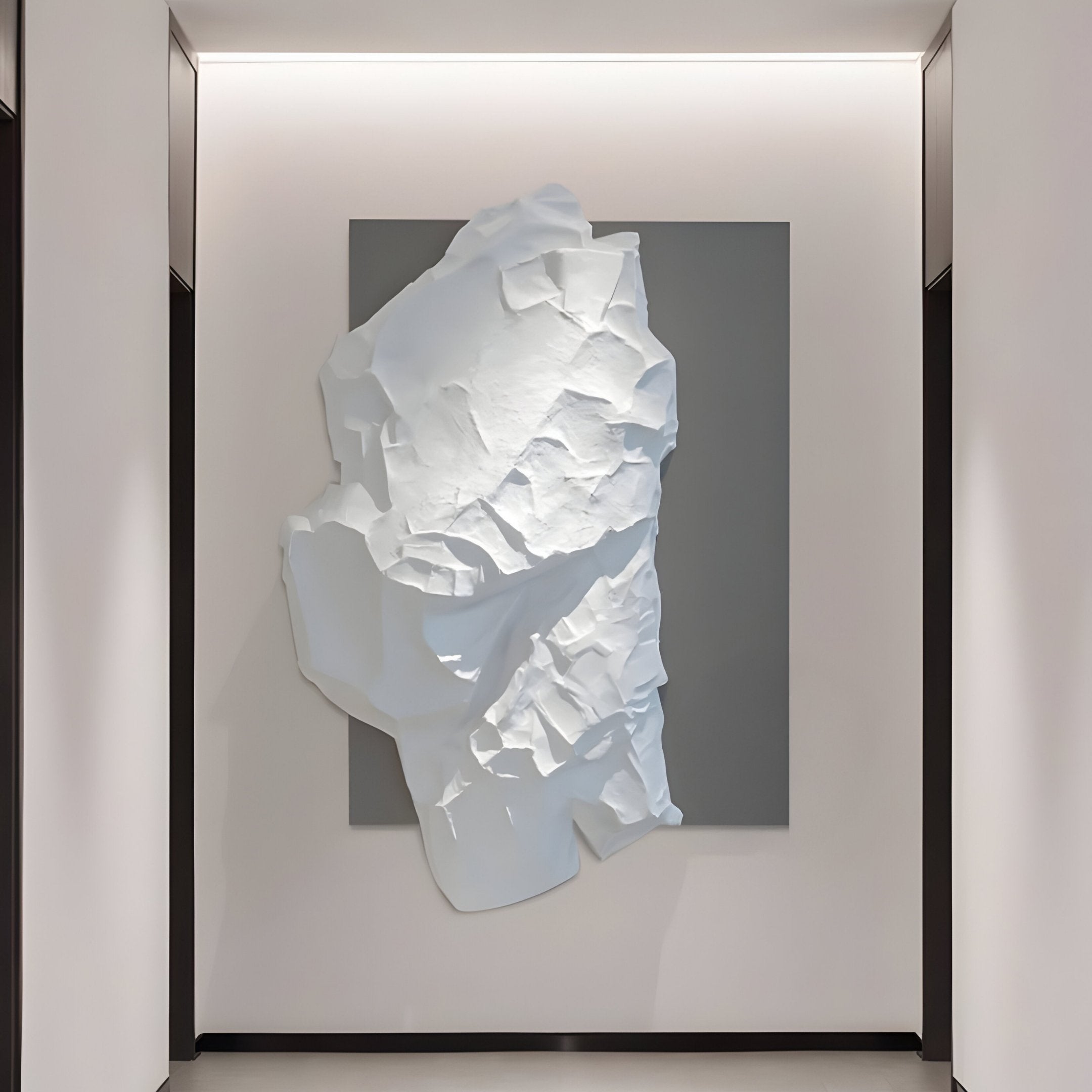The Veritas White & Grey Abstract Wood Relief 3D Wall Art by Giant Sculptures features a large, textured white abstract form on a dark gray square base. Installed in the gallery on a light wall with soft lighting, it embodies modern simplicity and elegance.