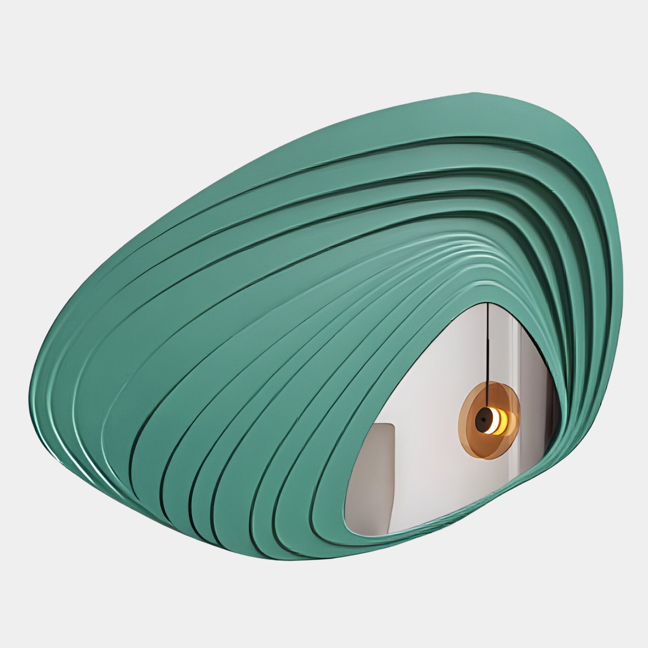 The Reflecta Green Wood Carving Mirror 3D Wall Art by Giant Sculptures features overlapping teal panels in a shell shape, reflecting a pendant light with a golden bulb in a minimalist space.