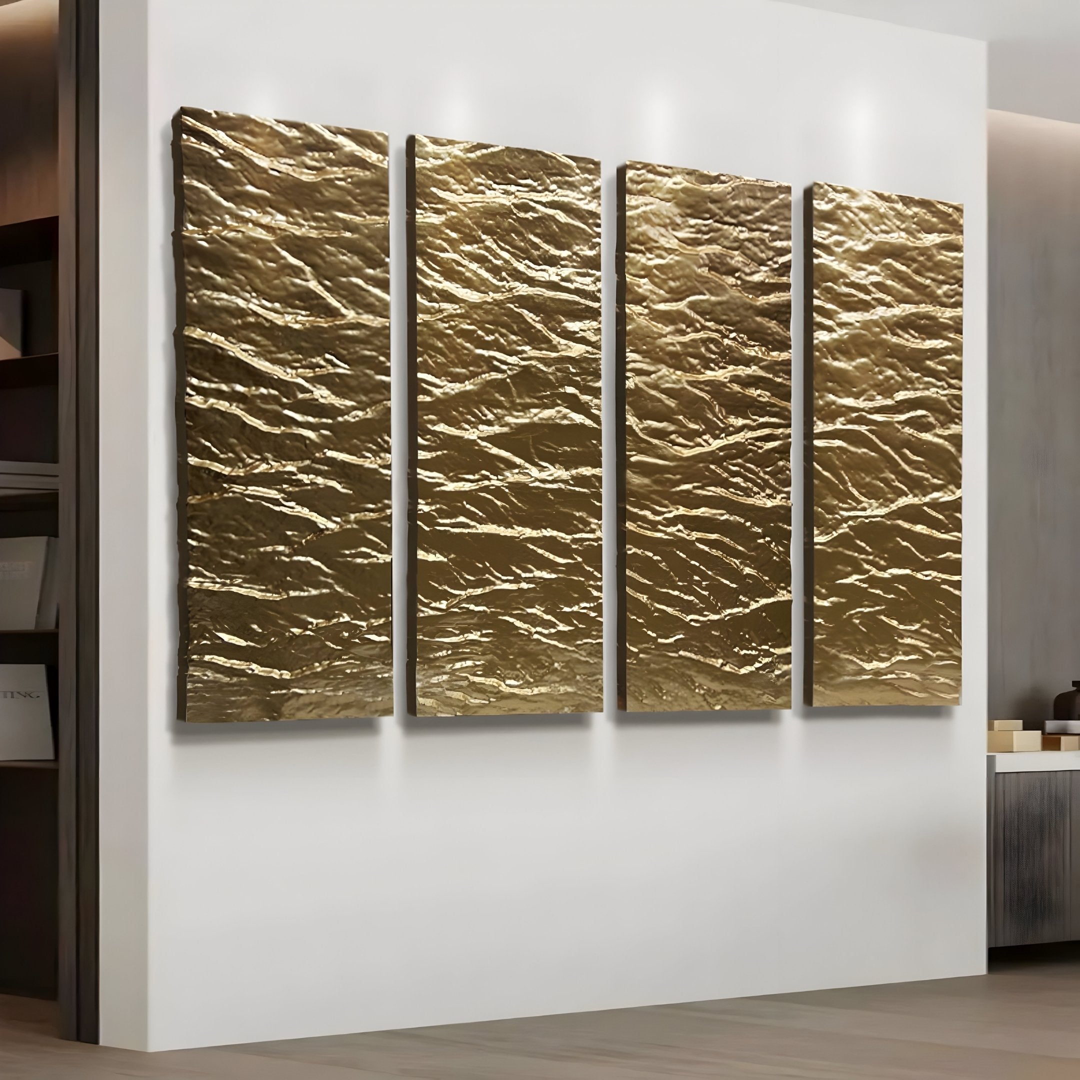 The Illume Gold I Hand-Painted Wood Relief 3D Wall Art by Giant Sculptures, comprising four vertical rectangular gold panels with wavy ripples, adds luxury to the white wall. These evenly spaced pieces beautifully enhance the rooms modern aesthetic and subtle lighting.