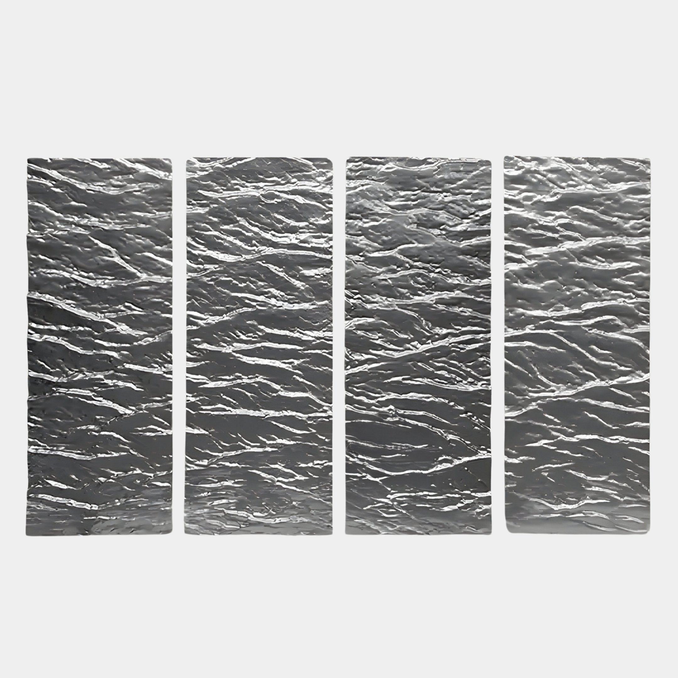 The Illume 4-Panel Silver Hand-Painted Wood Relief 3D Wall Art by Giant Sculptures features four vertically arranged panels with a wavy, textured surface that reflect light, emphasizing striking ripple patterns against a plain background.