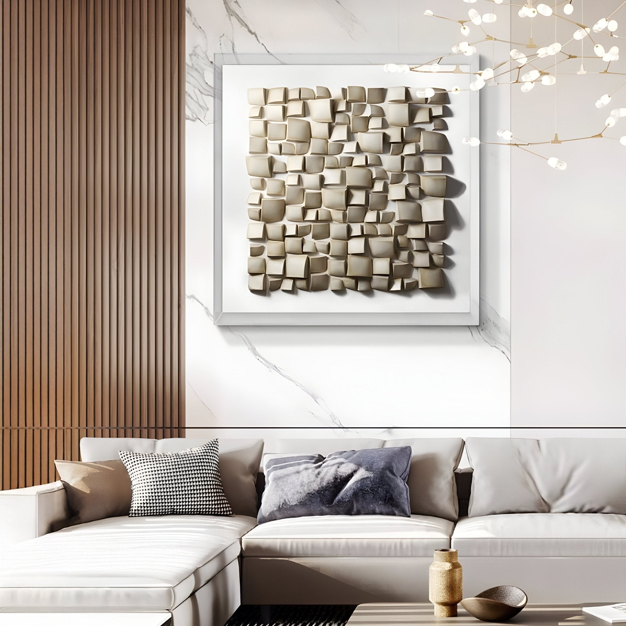 A modern living room features a white sectional sofa with cushions, a small coffee table with a gold centerpiece, and striking 3D wall art by Giant Sculptures over an Exalta Wood Relief 3D Wall Art in Acrylic Box, blending marble and wood panels.