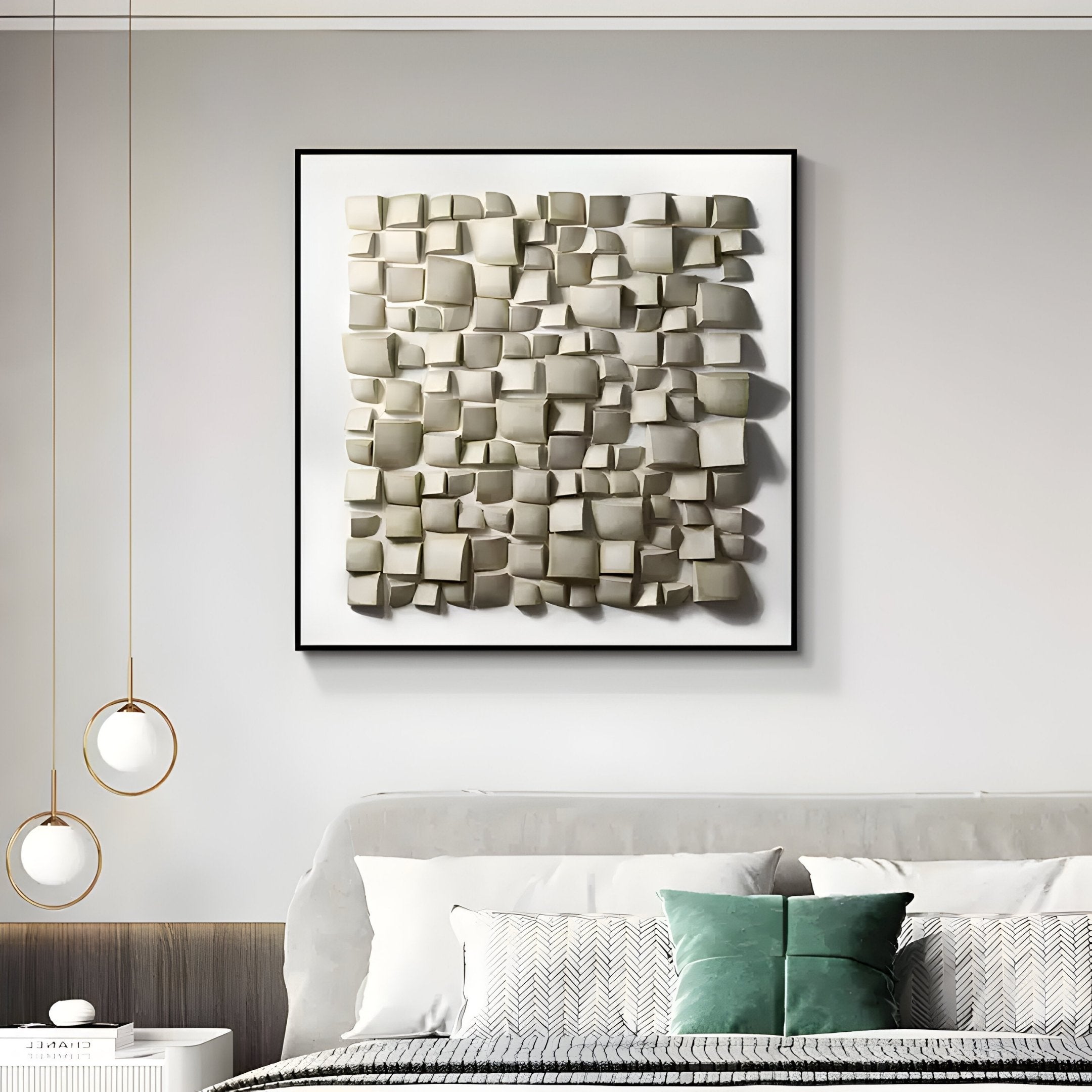 A contemporary bedroom highlights the Exalta Wood Relief Framed 3D Wall Art by Giant Sculptures, featuring beige geometric tiles in a black frame. The space includes a bed with green and white pillows and a white nightstand illuminated by two round pendant lights.