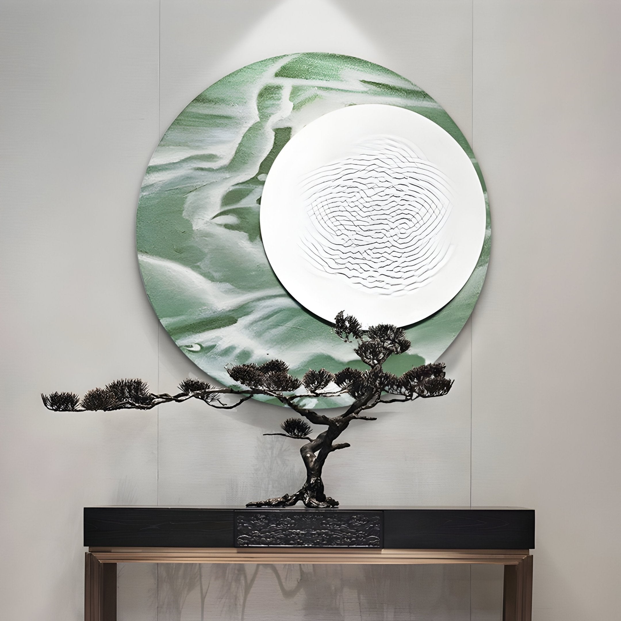 A minimalist display showcases a bonsai on a sleek table, set against Giant Sculptures’ Reveria Sage Green Abstract Wood Carving 3D Wall Art with marbled textures and a white disc—ideal for modern interiors.