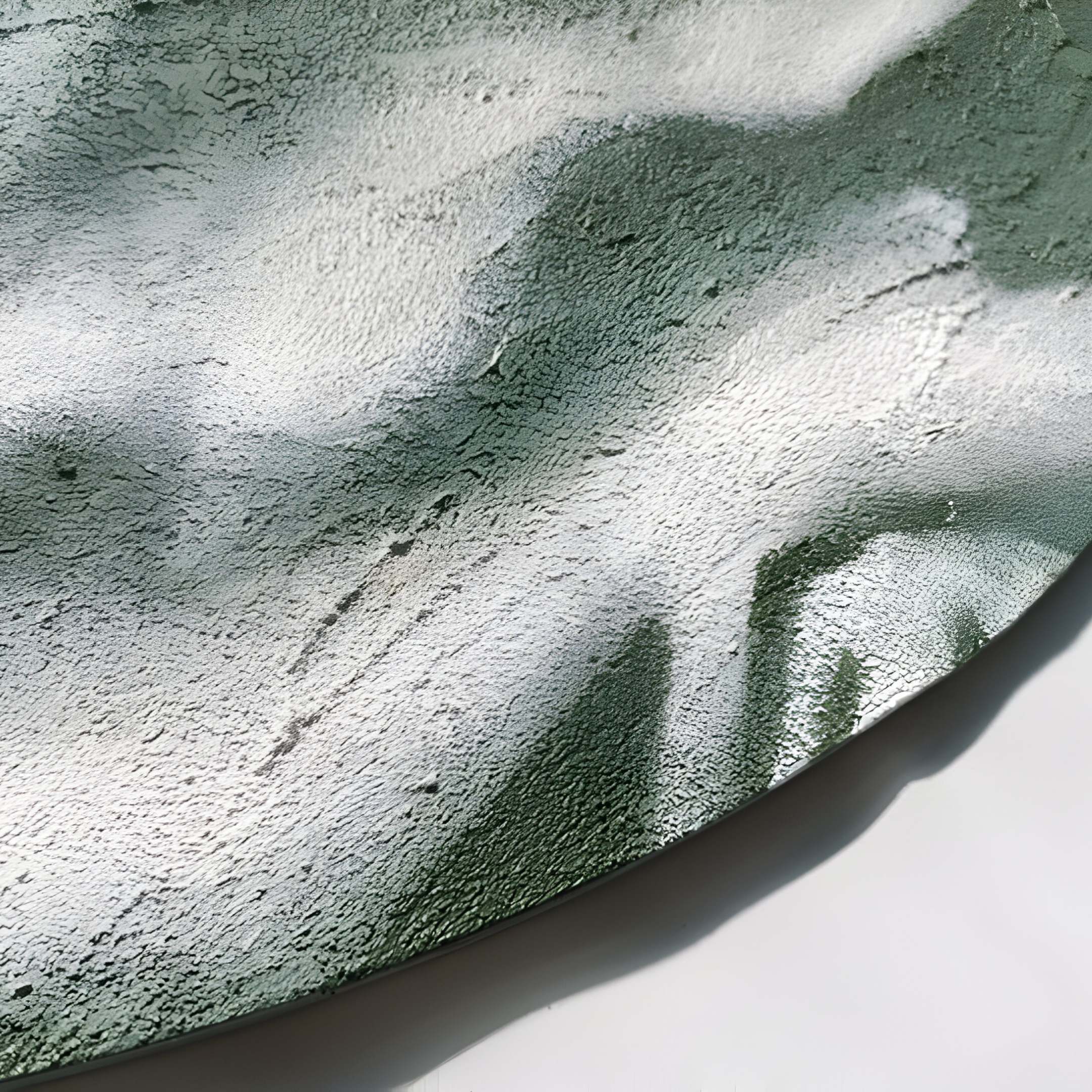 The Reveria Sage Green Abstract Wood Carving 3D Wall Art by Giant Sculptures features marbled sage green and white textures, with lighting that highlights its organic patterns—perfect for modern interiors.