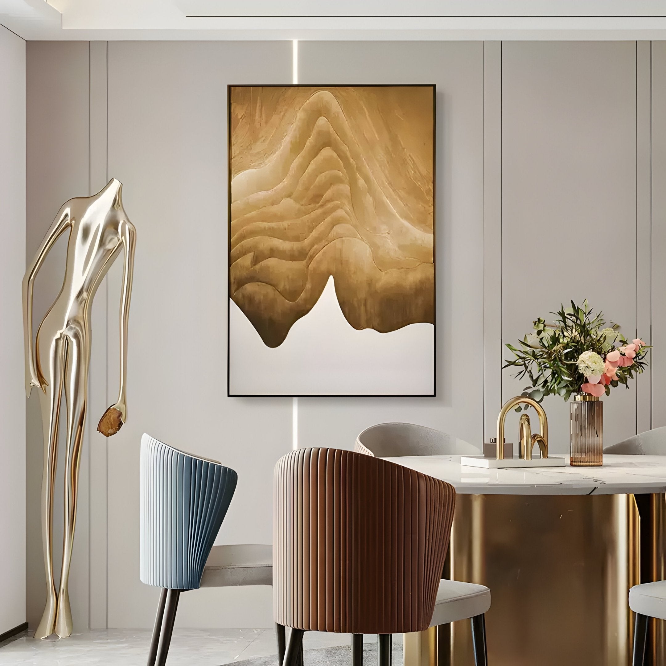 A modern dining room with pastel chairs, a gold dining table, flowers in a vase, a gold abstract sculpture, and striking Celoria Golden Dune Wood Carving 3D Wall Art by Giant Sculptures displayed on the wall.