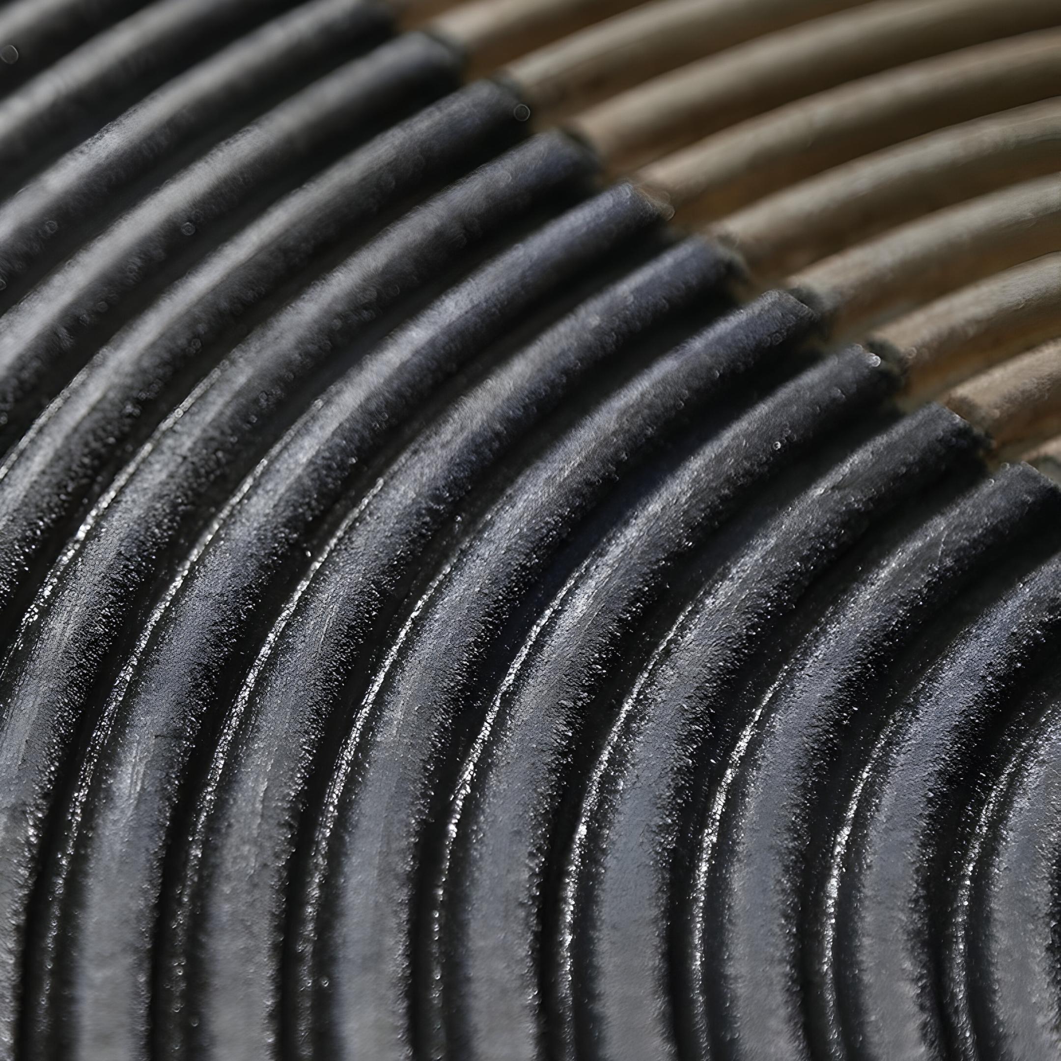 Close-up of the Artura Beige & Black Hand-Painted 3D Relief Wall Art by Giant Sculptures, showcasing parallel curved black and metallic ridges with a shiny, reflective surface—an elegant display of minimalist design.