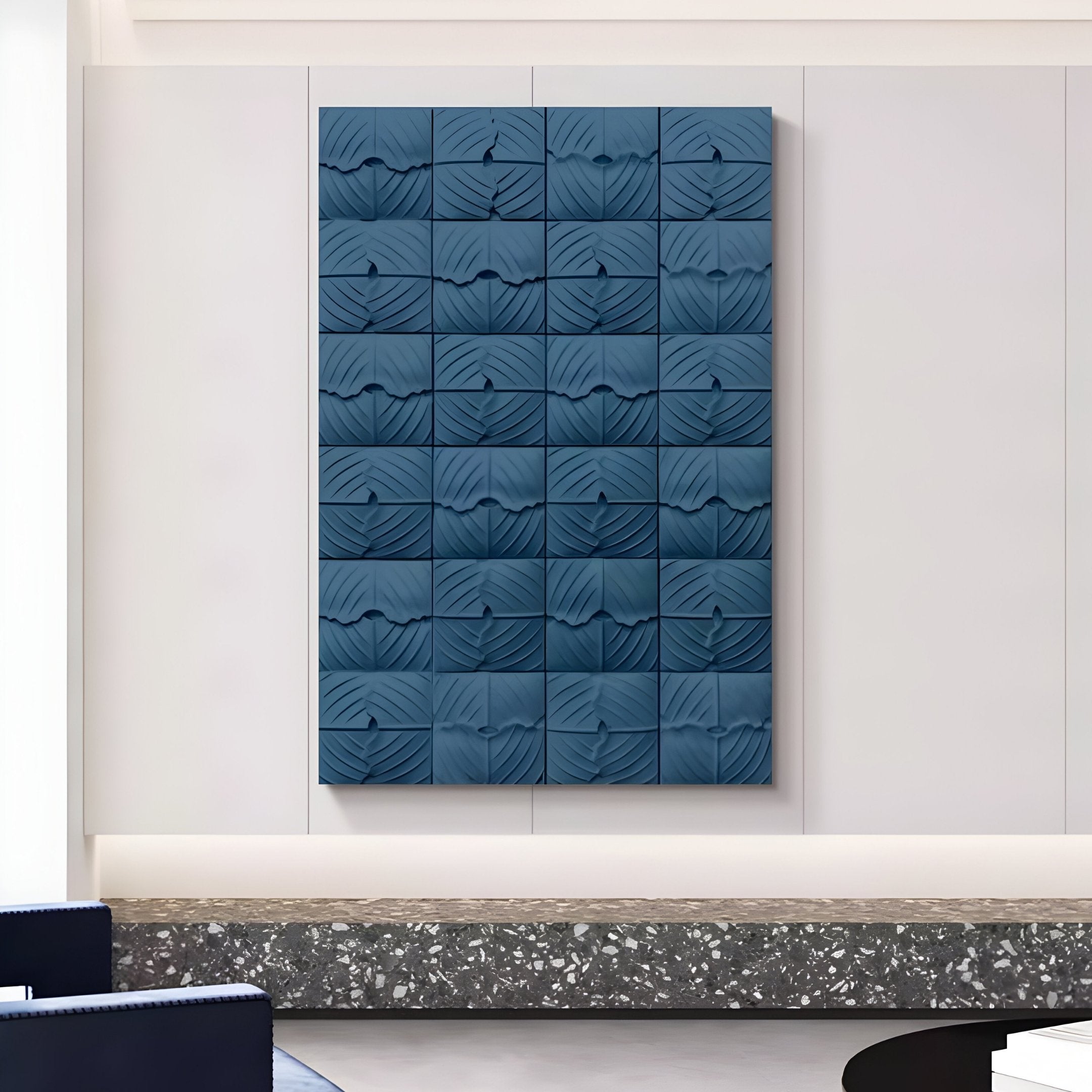 The Vellura Blue Textured Wood Relief 3D Wall Art by Giant Sculptures, featuring wavy panels in a 6-by-5 arrangement, brings sculptural elegance to modern, minimalist rooms with light walls and a terrazzo bench below.