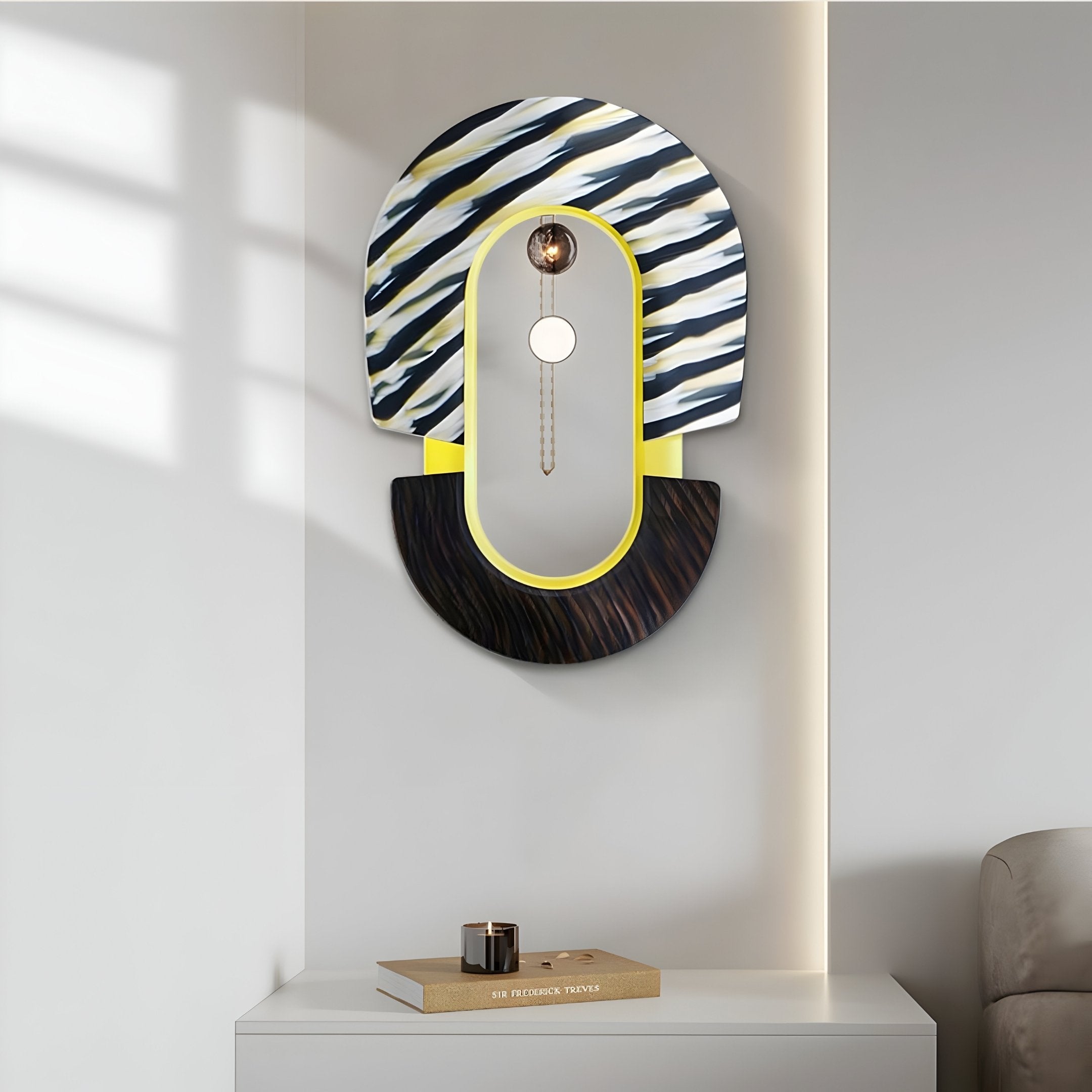 The Arcus Black & Yellow Zebra Stripes Mirror 3D Wooden Wall Art by Giant Sculptures features modern geometric design, with dark wood patterns on a light gray wall. A small candle and The Perfection Trap rest on a white cabinet below, casting soft shadows in elegant decor.