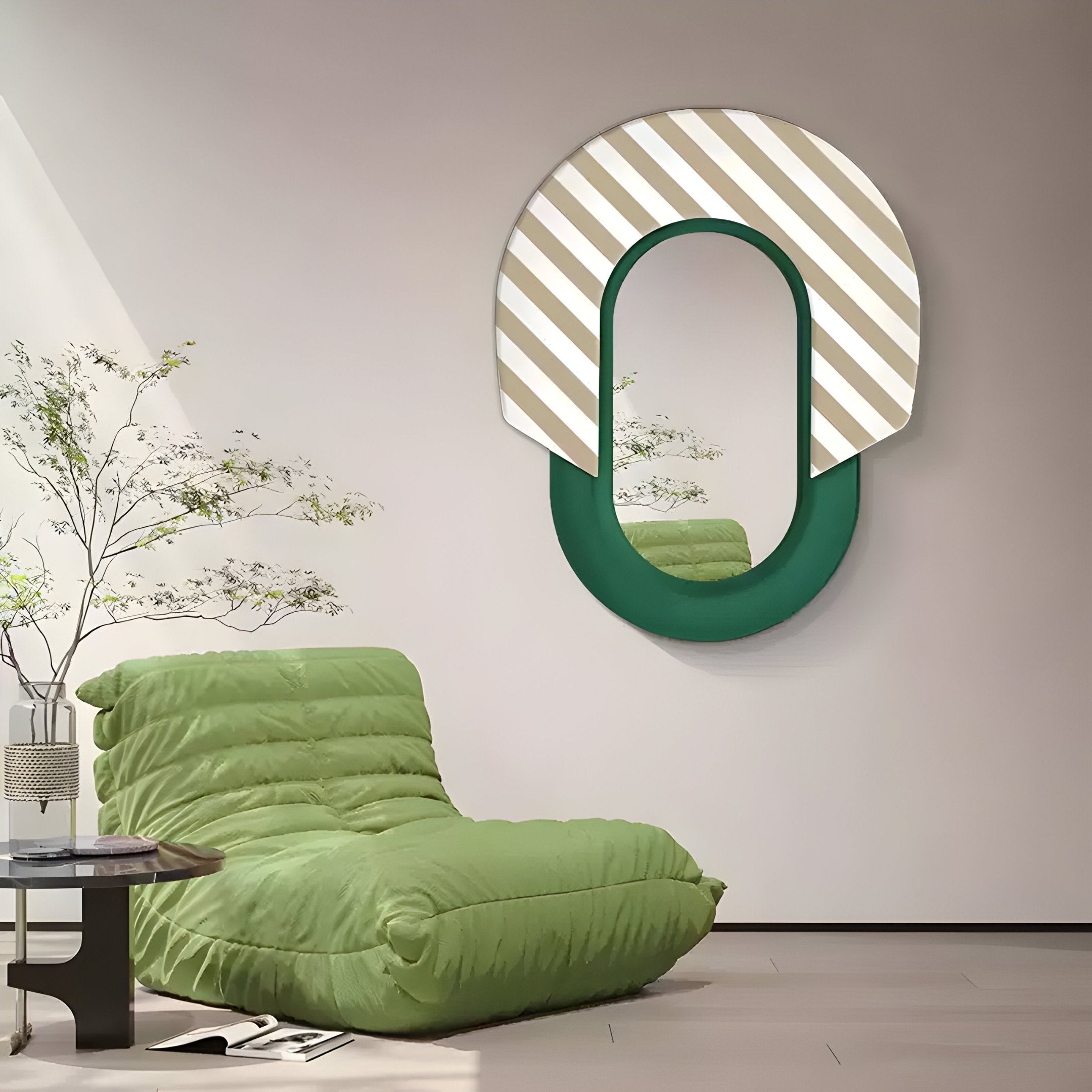 A modern living room features the Arcus Green & Beige-White Striped Mirror 3D Wooden Wall Art by Giant Sculptures, paired with a green cushioned lounge chair beside a small black side table topped with a potted plant. The space is minimalistic and well-lit.