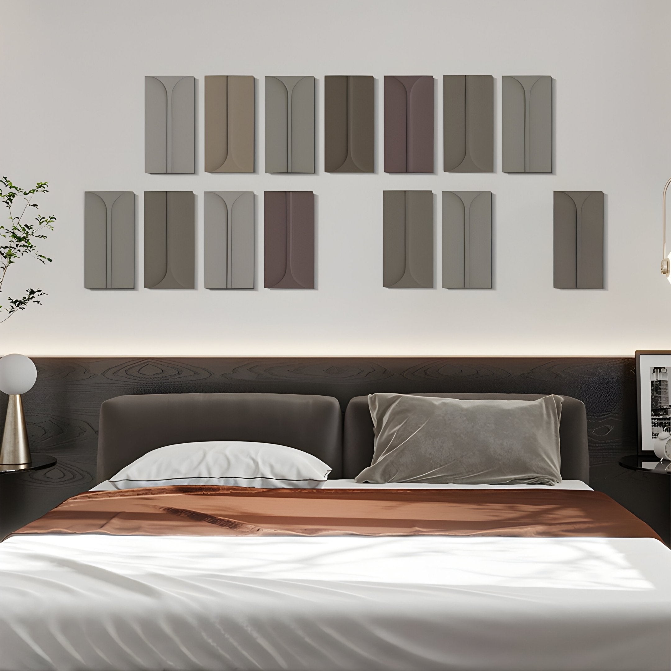 A modern bedroom features a dark wooden bed with taupe bedding. Above it, the Eximia Neutral Tones Multi-Panel Wood Relief by Giant Sculptures offers 3D wall art on the white wall. To the left, a small nightstand holds a plant and a spherical lamp.