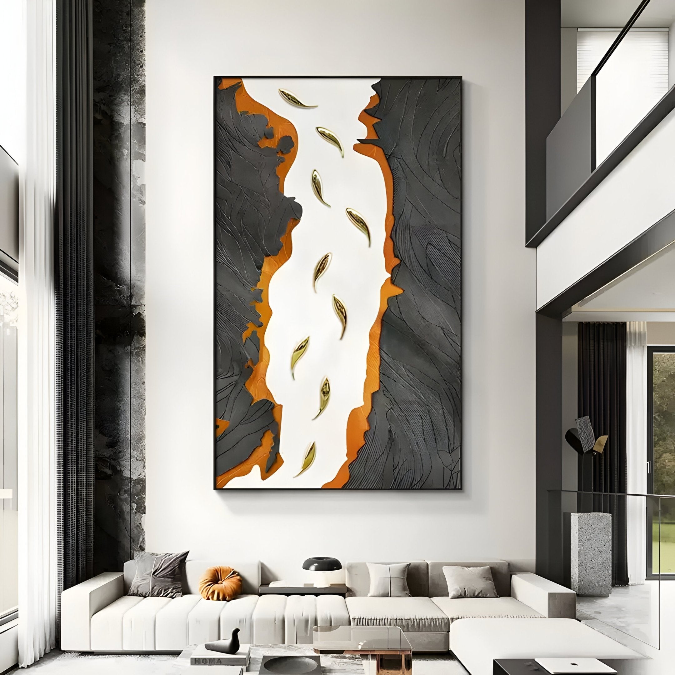 A modern living room with high ceilings features the Prosper Black & Orange Metallic Fish 3D Relief Wall Art by Giant Sculptures, adding sculptural harmony. A gray sofa and a small table complement it, while tall windows invite natural light to enhance the spaces prosperity and positive energy.