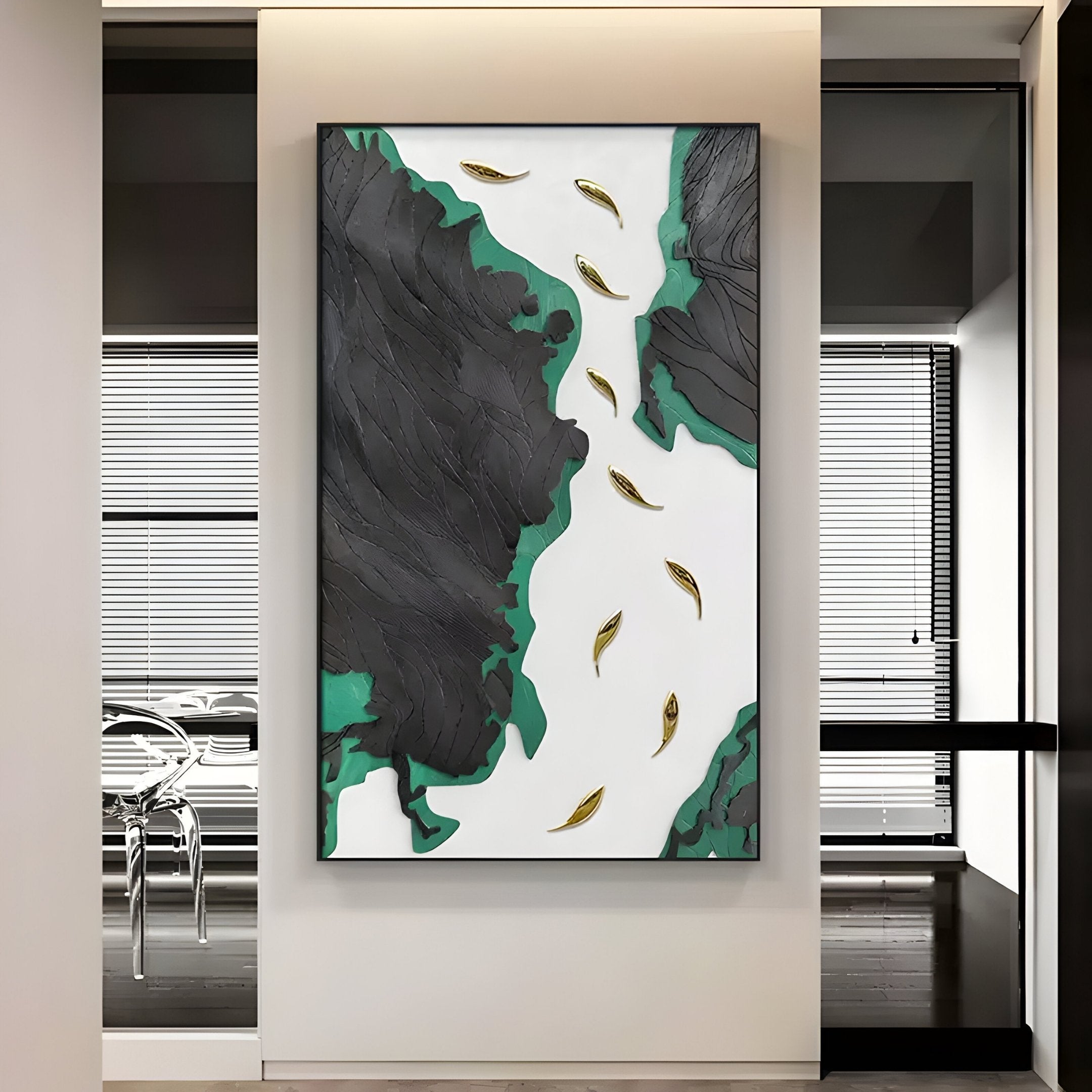 The Prosper Black & Green Metallic Fish 3D Relief Wall Art by Giant Sculptures features jagged black and green shapes on a white background with curved, gold leaf-like elements, adding elegance and artistry to a modern room with glass walls and minimalistic furniture.