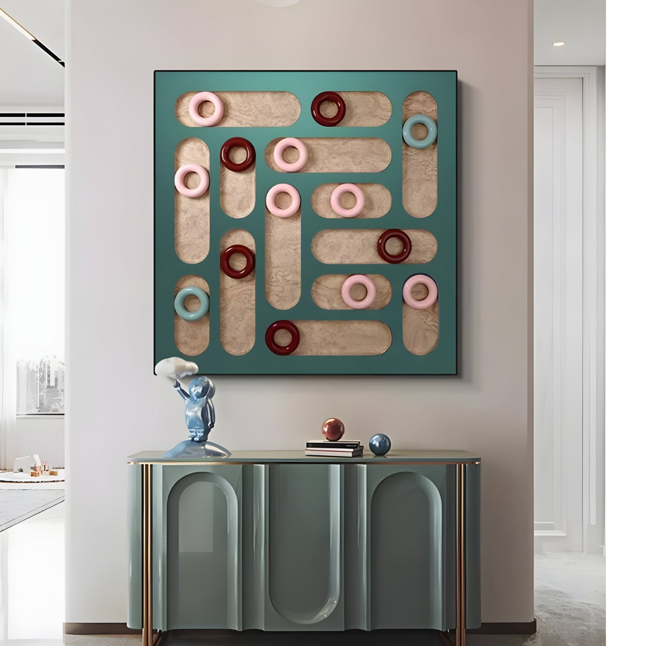 The Formexa Ring Geometric Wood Relief 3D Wall Art by Giant Sculptures showcases Nordic-inspired circles in pink, red, and blue. Below it, a sleek green console table displays a small sculpture and decorative items, enhancing the rooms contemporary style.