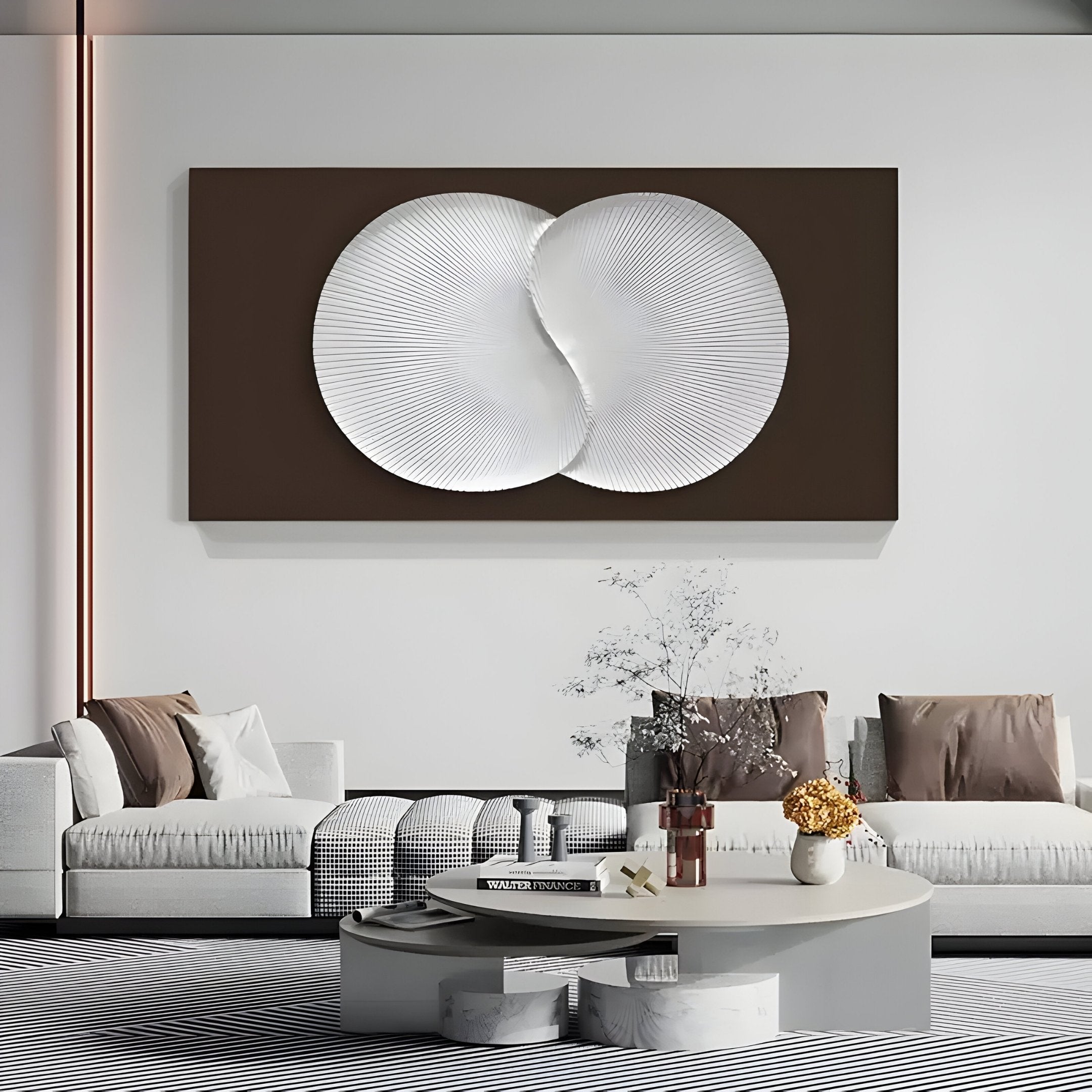 A modern living room showcases the Artivio Dark Brown & White Wood Relief 3D Wall Art by Giant Sculptures, complemented by two white sofas around a round coffee table. Subtle lighting and earth-tone accents enhance the cozy, minimalist ambiance.