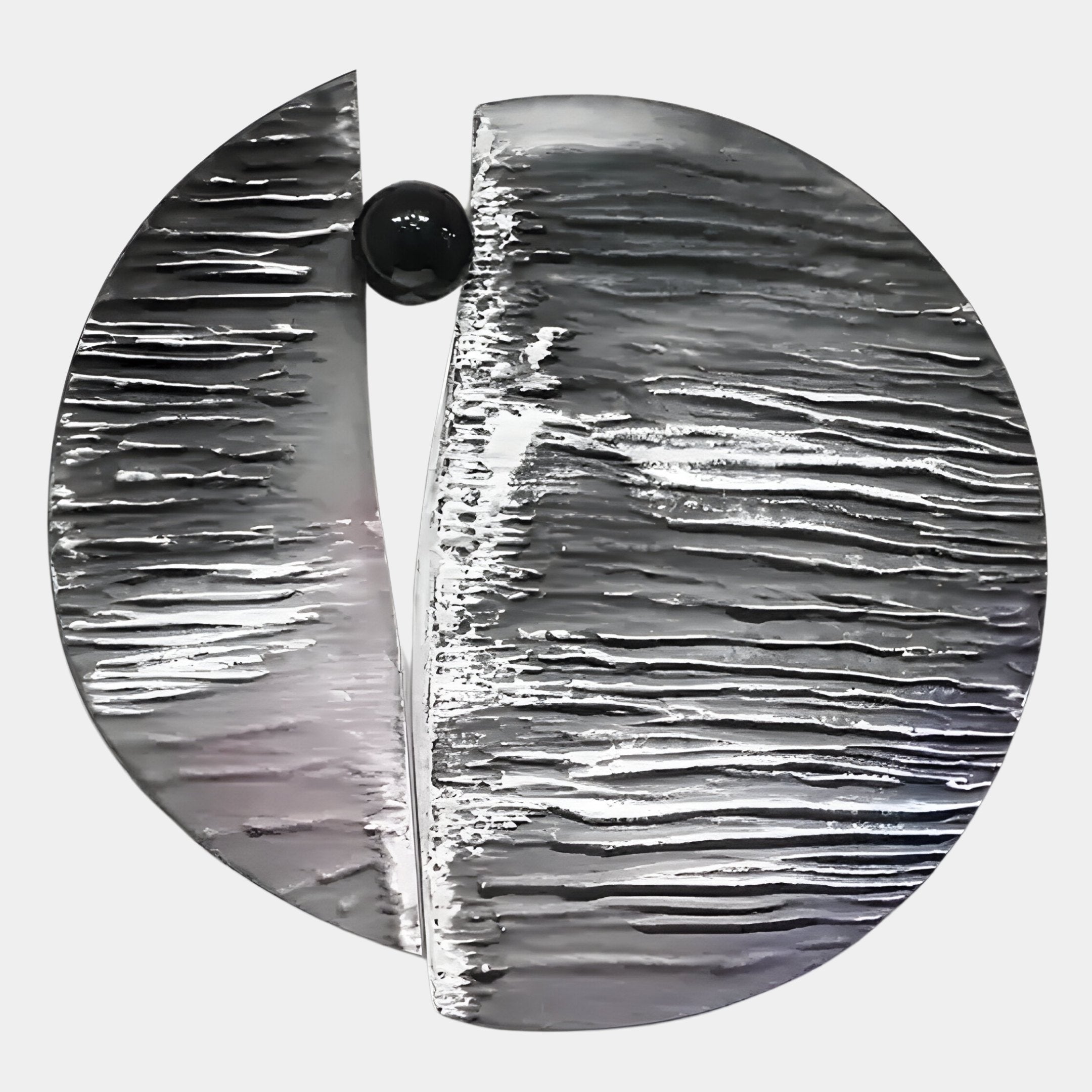 The Argentum Textured Wood Relief 3D Wall Art With Black Metal Ball by Giant Sculptures is a striking, modern piece featuring a silver, rippled surface split vertically and a black metal ball nestled between the two halves.