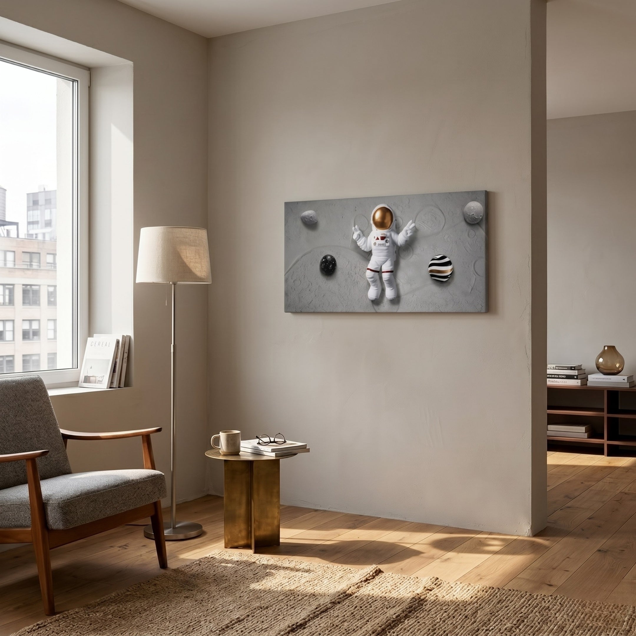 A modern living room features a gray armchair, gold side table, and floor lamp. Sunlight highlights the neutral space adorned with Giant Sculptures' Astravera Galactic Orbit Planet Astronaut 3D Wall Art.