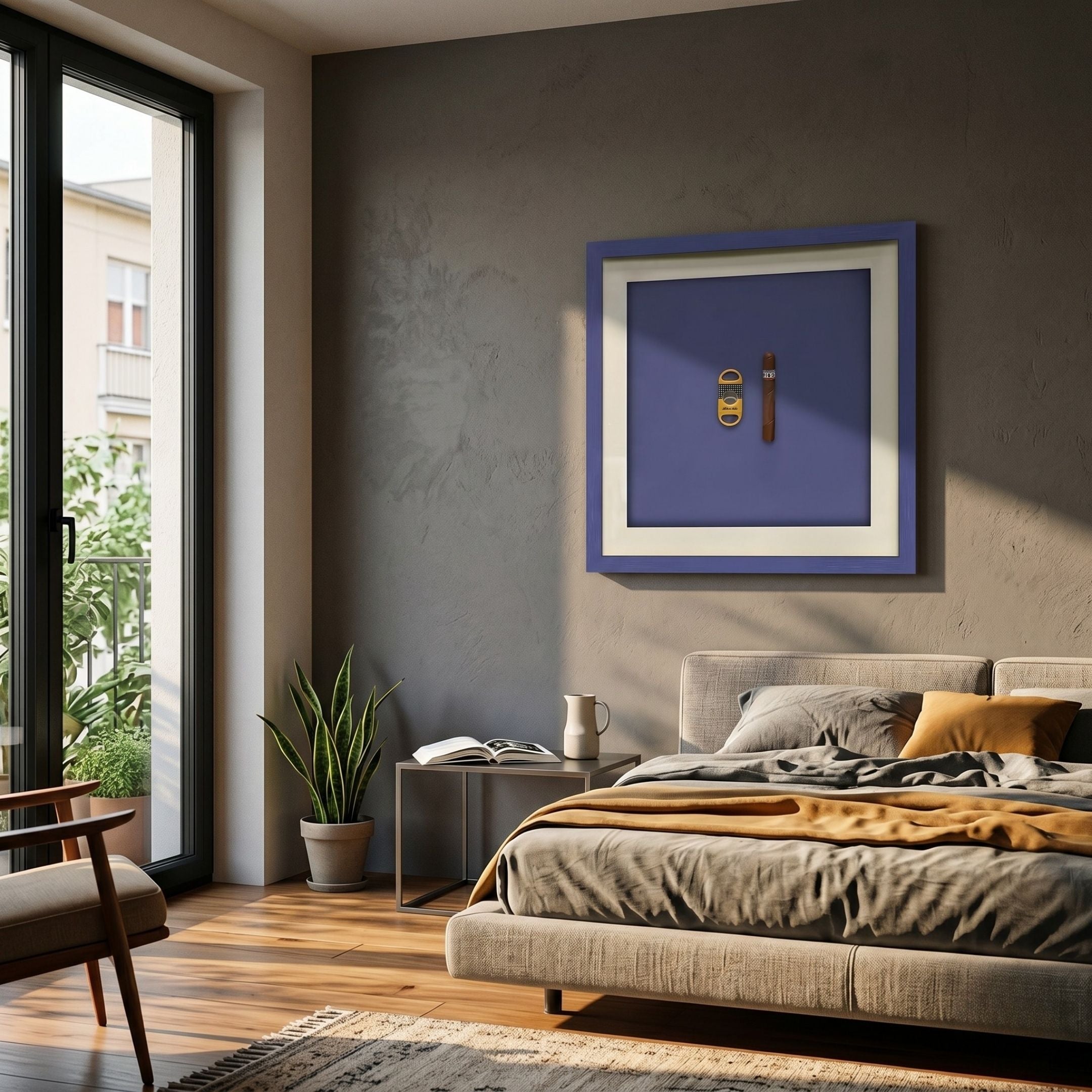 Cavallero Blue Cigar & Cutter Framed Wall Art by Giant Sculptures displayed above a bed in a modern bedroom with a snake plant, side table, and balcony view.