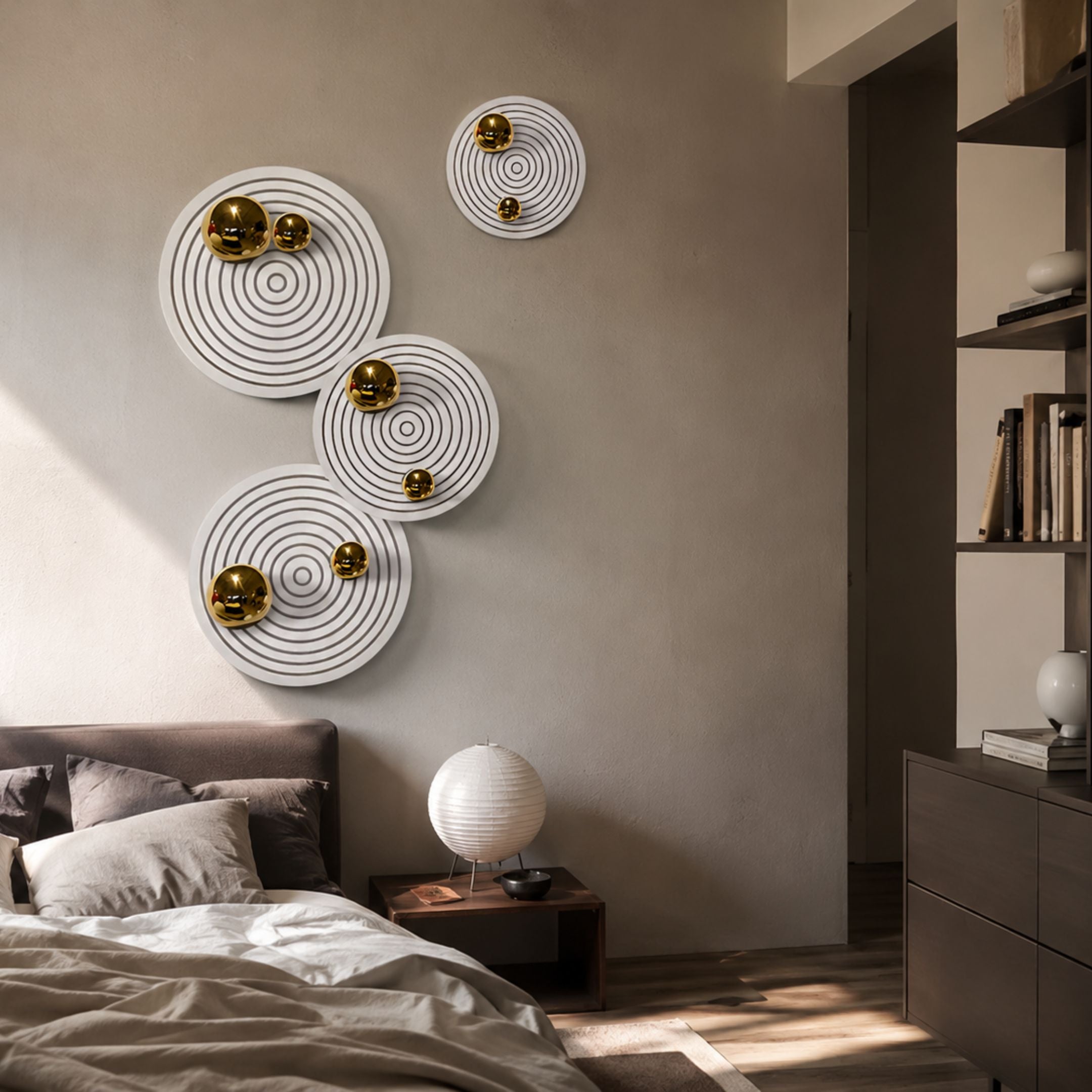 Orbiora Gold Orb 4-Panel Concentric Sphere 3D Wall Art by Giant Sculptures arranged on a bedroom wall above a bed with paper lantern lamp nearby.
