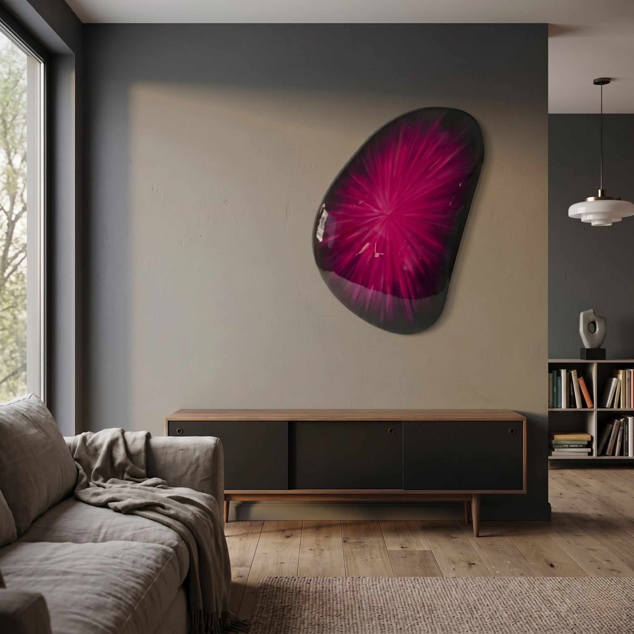 Veyora Magenta Bloom 3D Relief Wall Art by Giant Sculptures, glossy magenta starburst on black, mounted above a wooden sideboard in a modern living room.